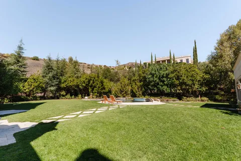 a view of a playground with basketball court