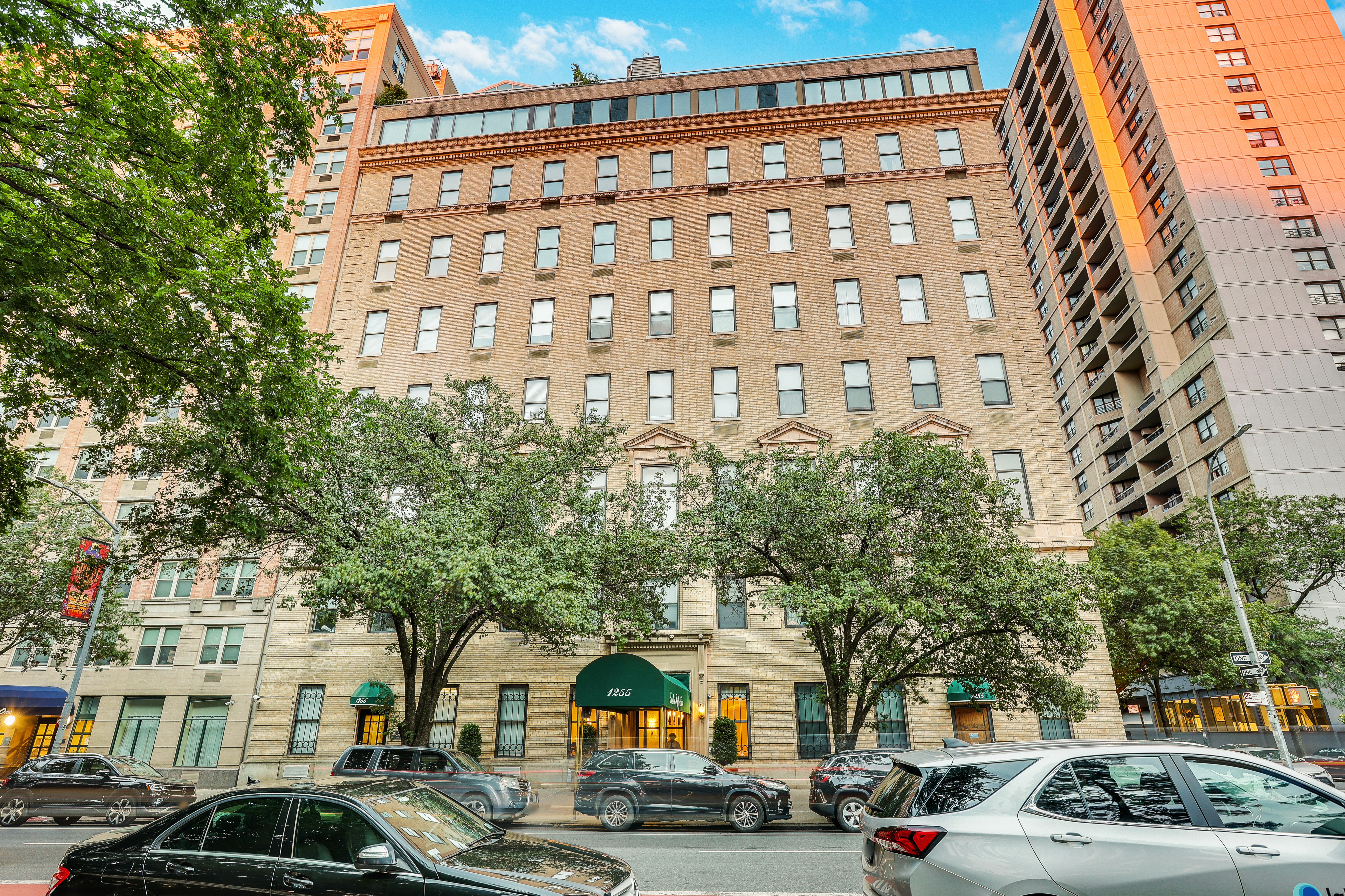 1255 5th Avenue, Unit 5B Manhattan, NY 10029 - Photo 2 of 12 a couple of cars parked in front of a building