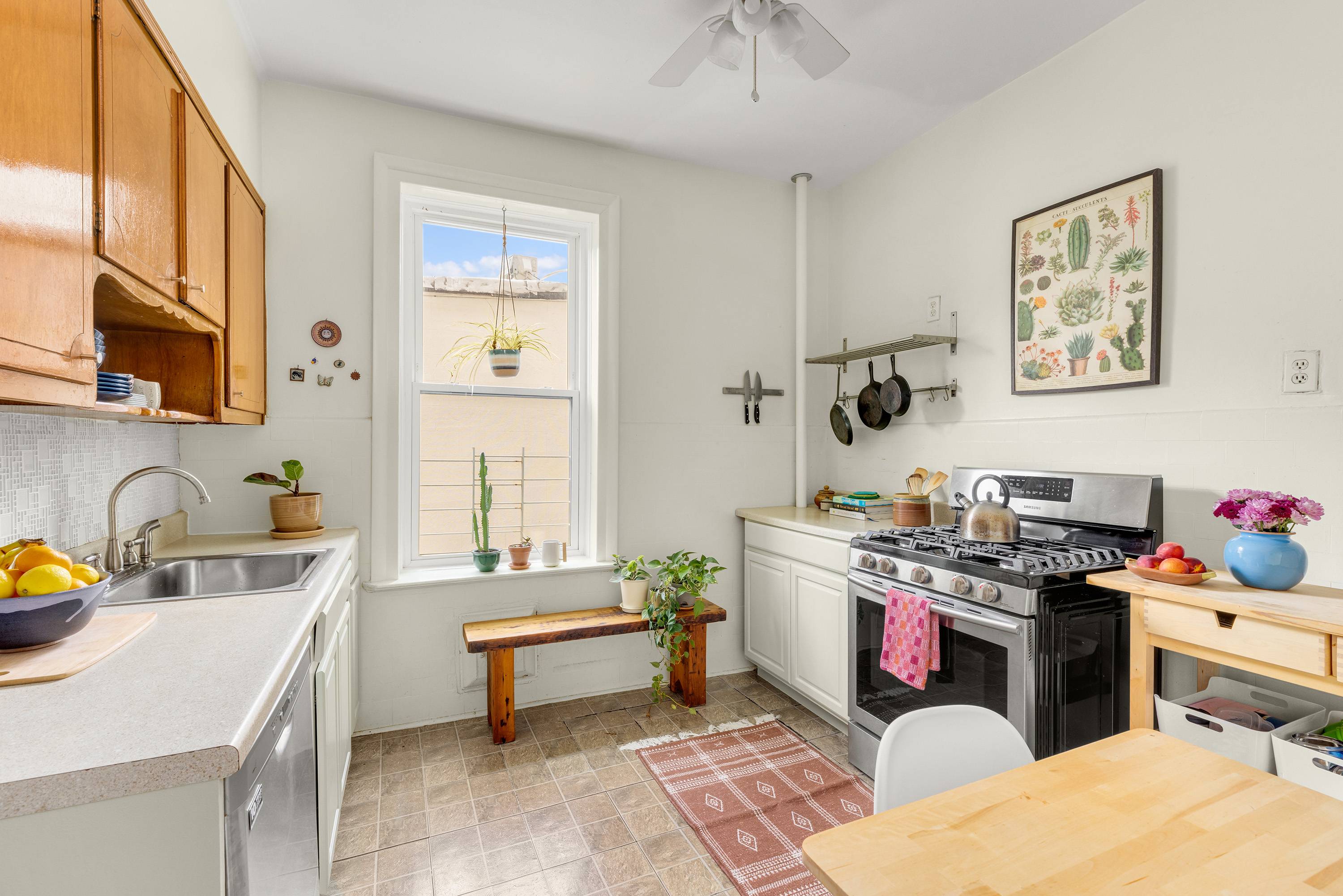 765 42nd Street, Unit 20 Brooklyn, NY 11232 - Photo 6 of 10 a room with a couch and a workspace