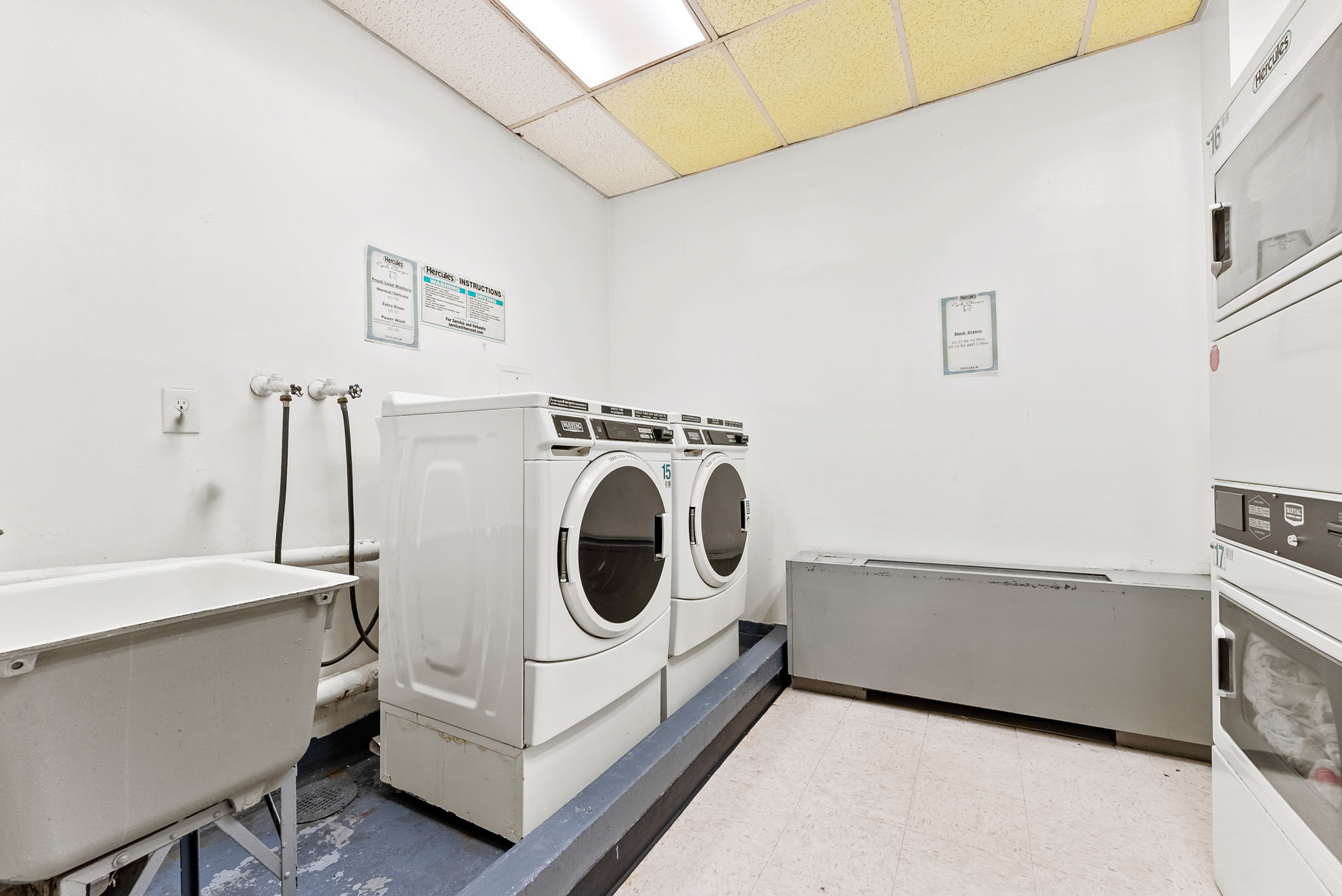 310 East 46th Street, Unit 5T Manhattan, NY 10017 - Photo 10 of 13 a utility room with dryer and washer