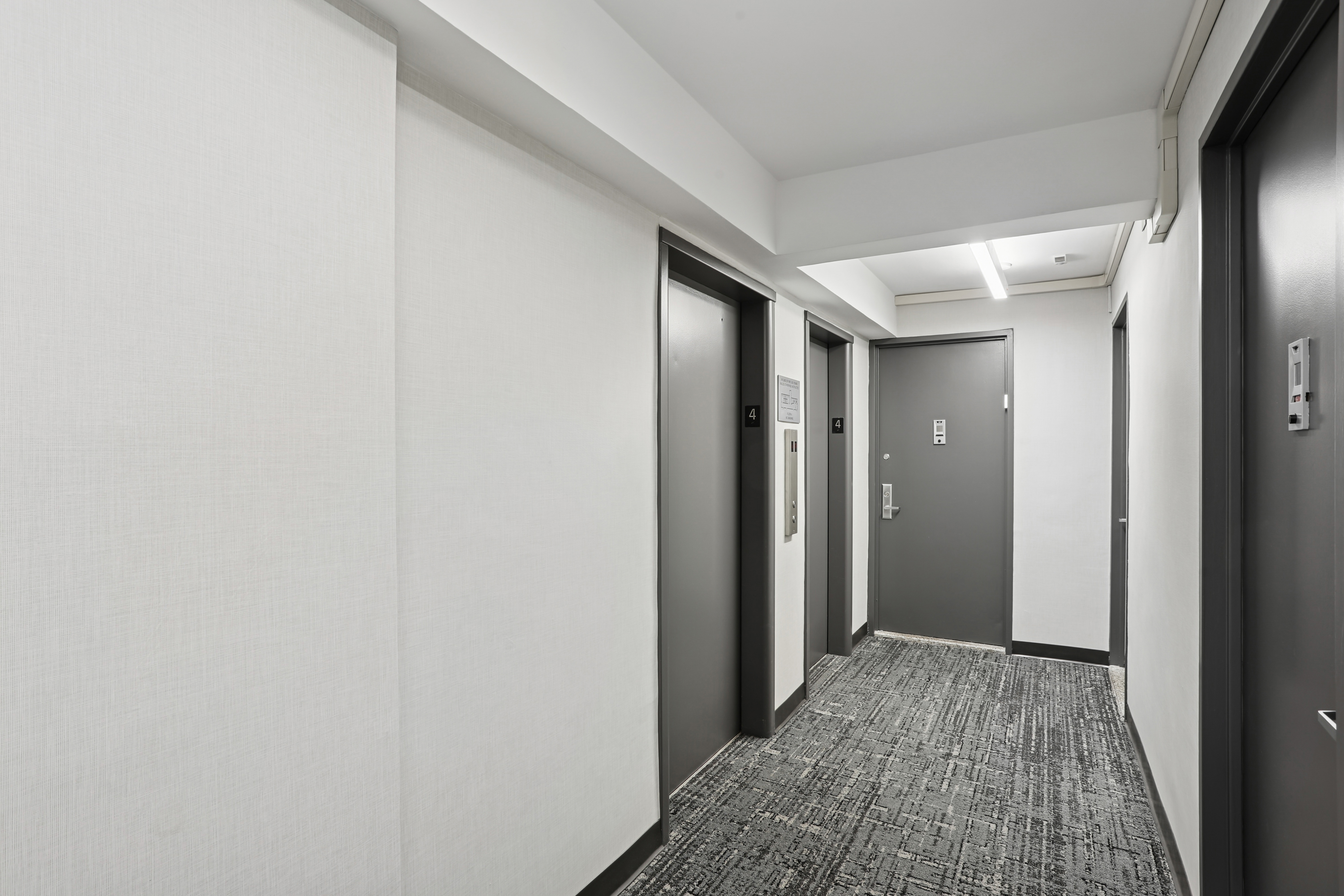 335 East 51st Street, Unit 4H Manhattan, NY 10022 - Photo 9 of 13 a view of hallway with wooden floor