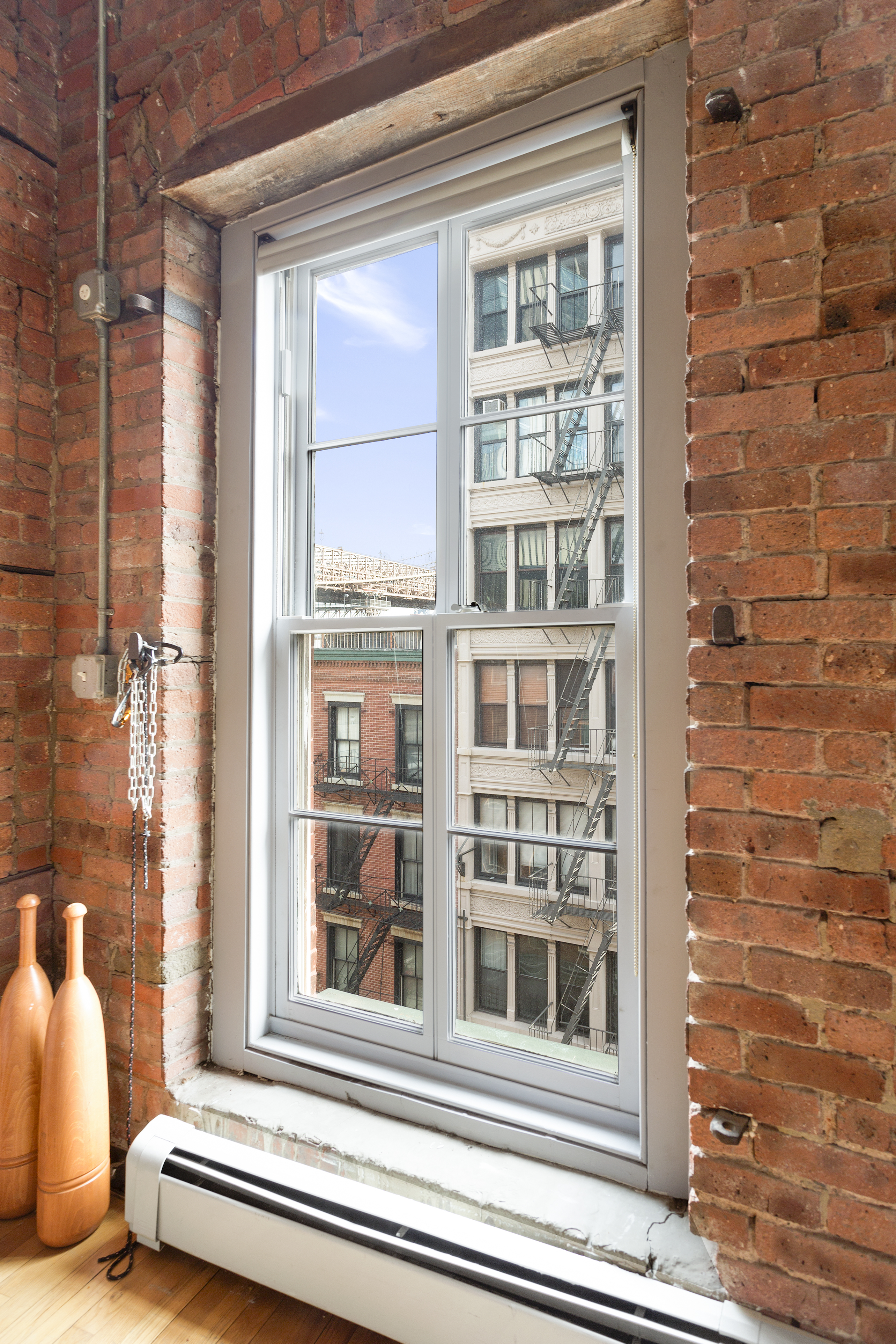 272 Water Street, Unit 5F Manhattan, NY 10038 - Photo 5 of 12 a view of a door and a window