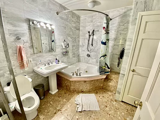 351 7th Avenue, Unit 2 Brooklyn, NY 11215 - Photo 10 of 10 a bathroom with a sink toilet and shower