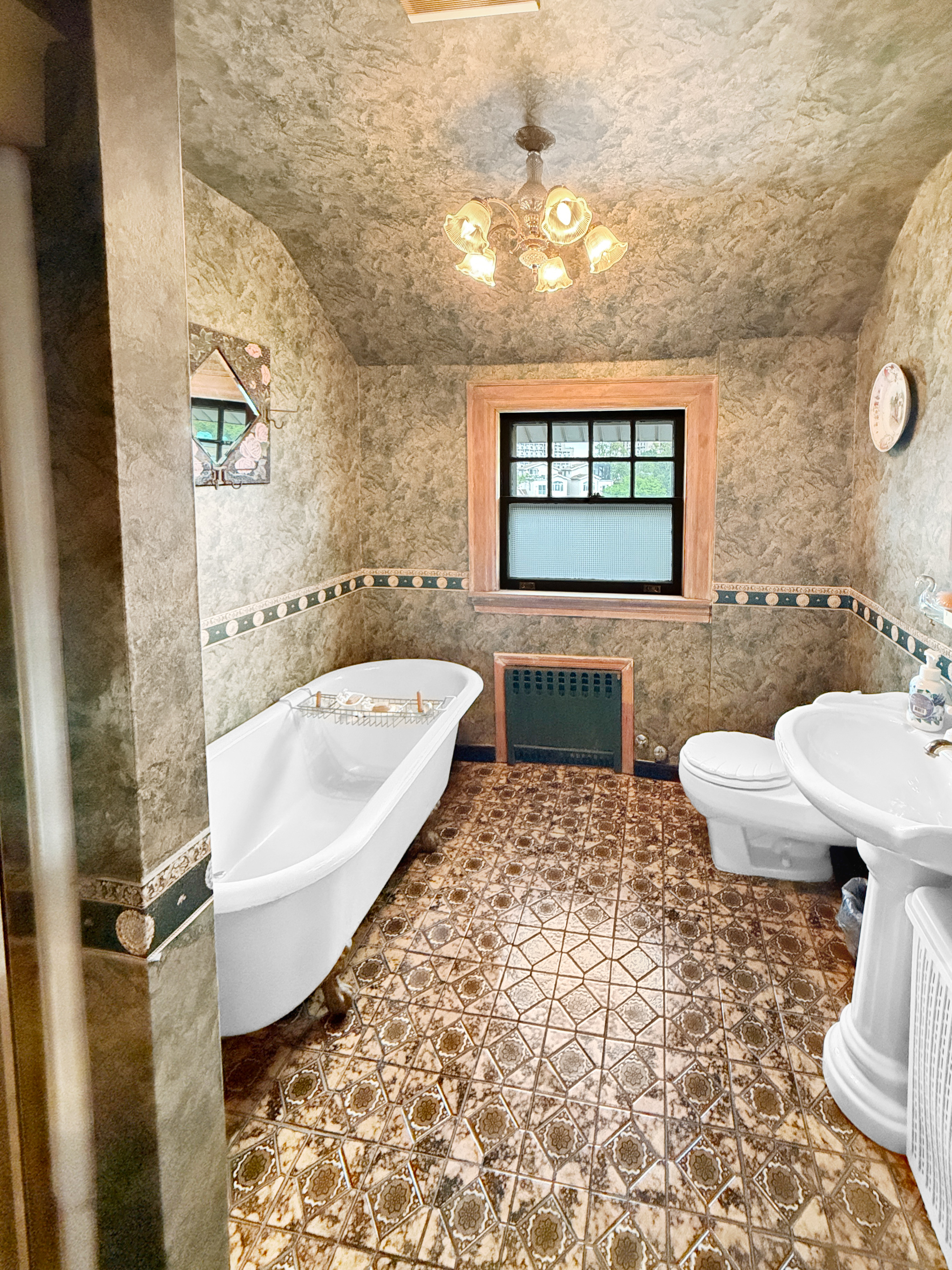 3829 Beach 38th Street Brooklyn, NY 11224 - Photo 20 of 31 a bathroom with a sink a toilet and bathtub