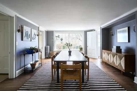 a view of a livingroom with furniture and windows