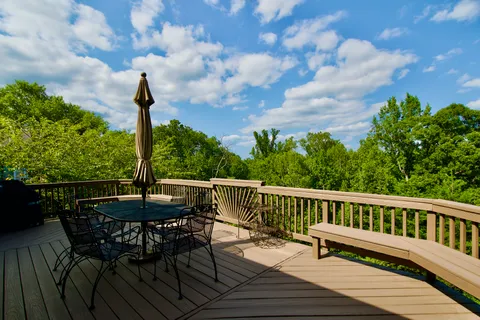 a view of a chairs on the roof deck