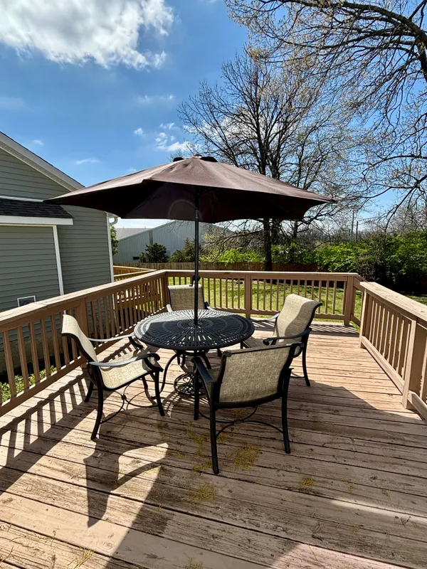 a view of chair and table on the wooden floor