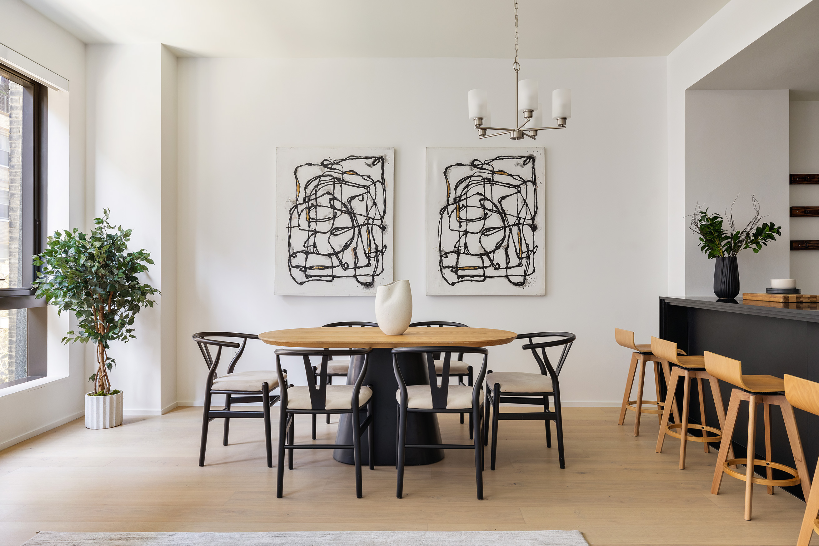121 East 22nd Street, Unit S603 Manhattan, NY 10010 - Photo 3 of 12 a view of a dining room with furniture and chandelier