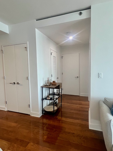2 Northside Piers, Unit 26C Brooklyn, NY 11249 - Photo 14 of 21 a view of a room with wooden floor and lounge chair