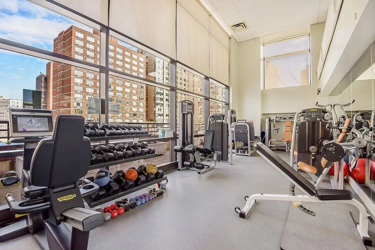 160 West 66th Street, Unit 17E Manhattan, NY 10023 - Photo 9 of 13 a view of a room with gym equipment