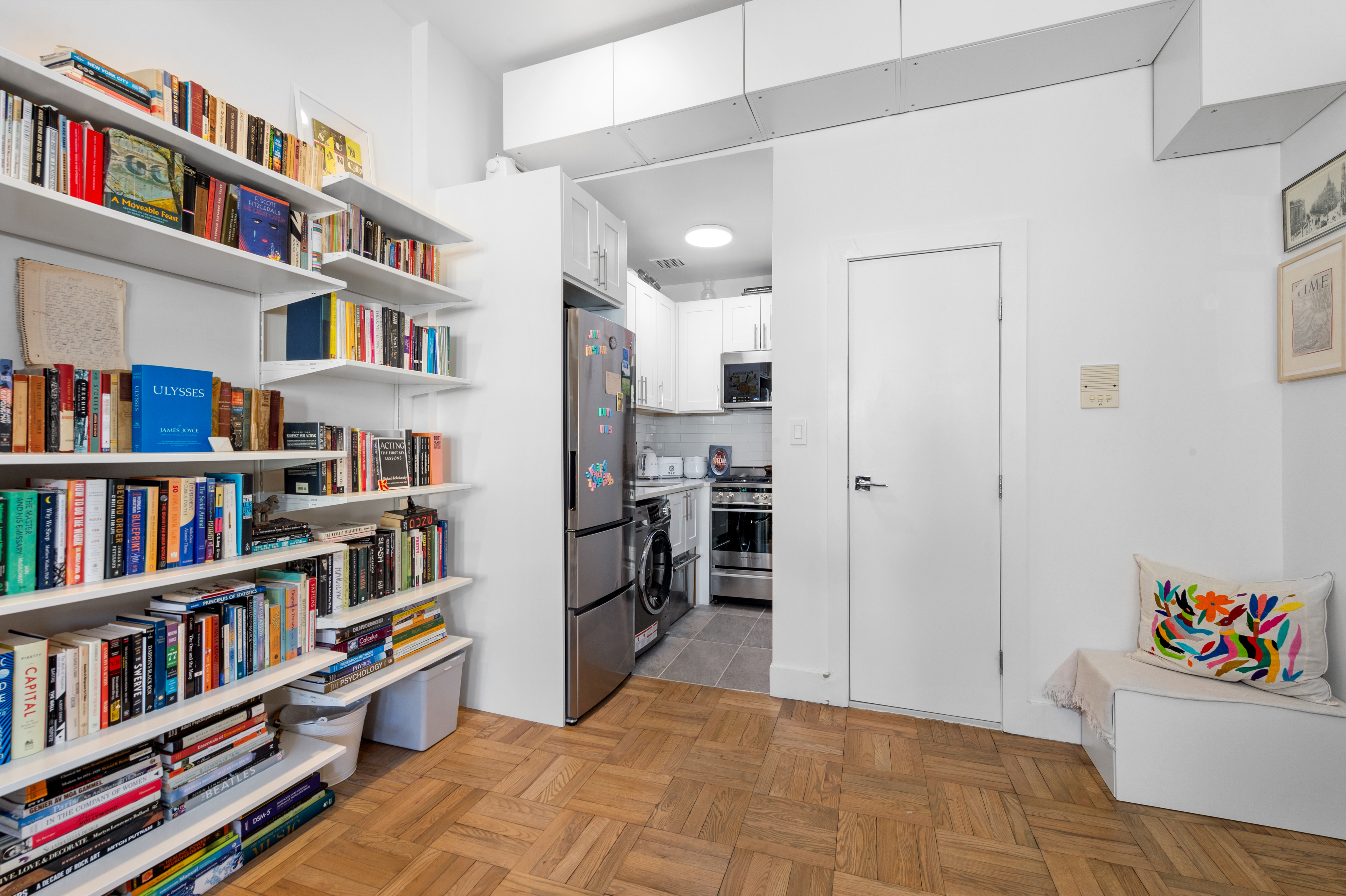122 West 80th Street, Unit 3F Manhattan, NY 10024 - Photo 10 of 15 a room with bookshelf and a workspace
