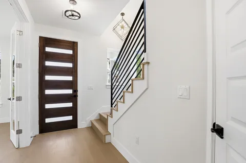 an entryway in a hall with a window