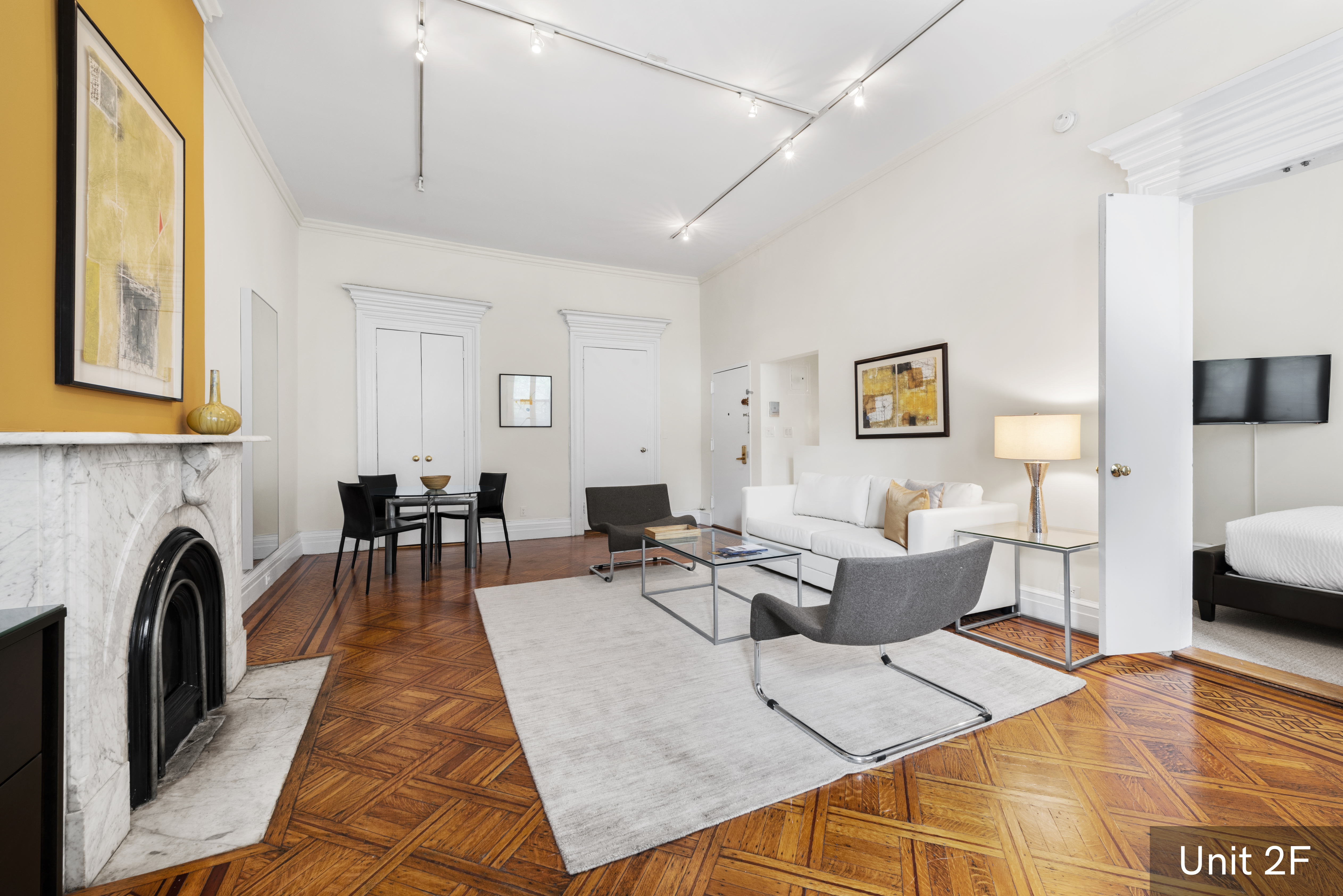 120 East 19th Street Manhattan, NY 10003 - Photo 24 of 33 a living room with furniture and a fireplace