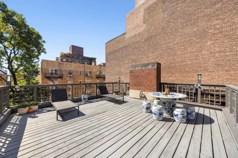 a view of roof deck with patio
