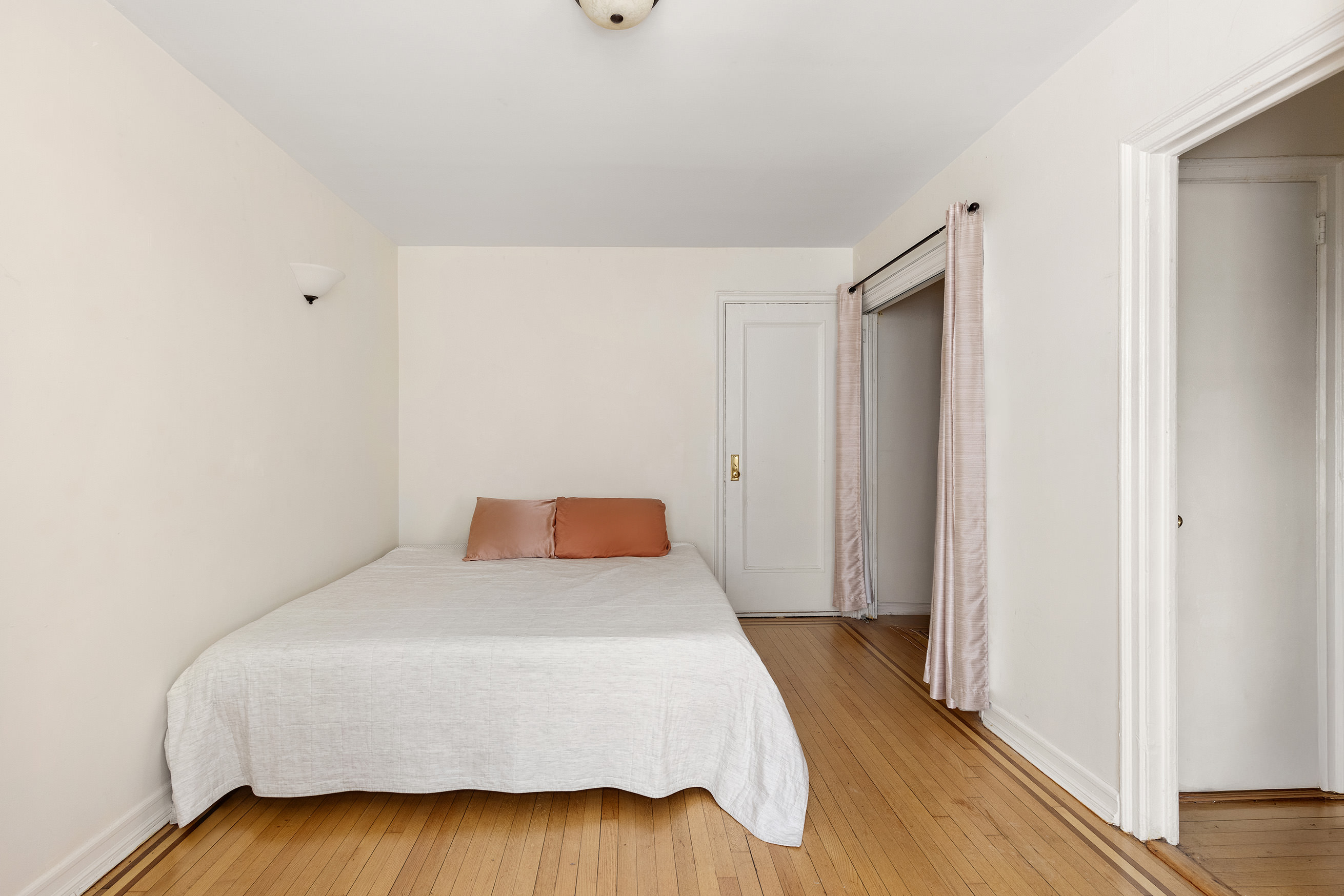 300 8th Avenue, Unit 4G Brooklyn, NY 11215 - Photo 2 of 6 a bedroom with a bed and wooden floor