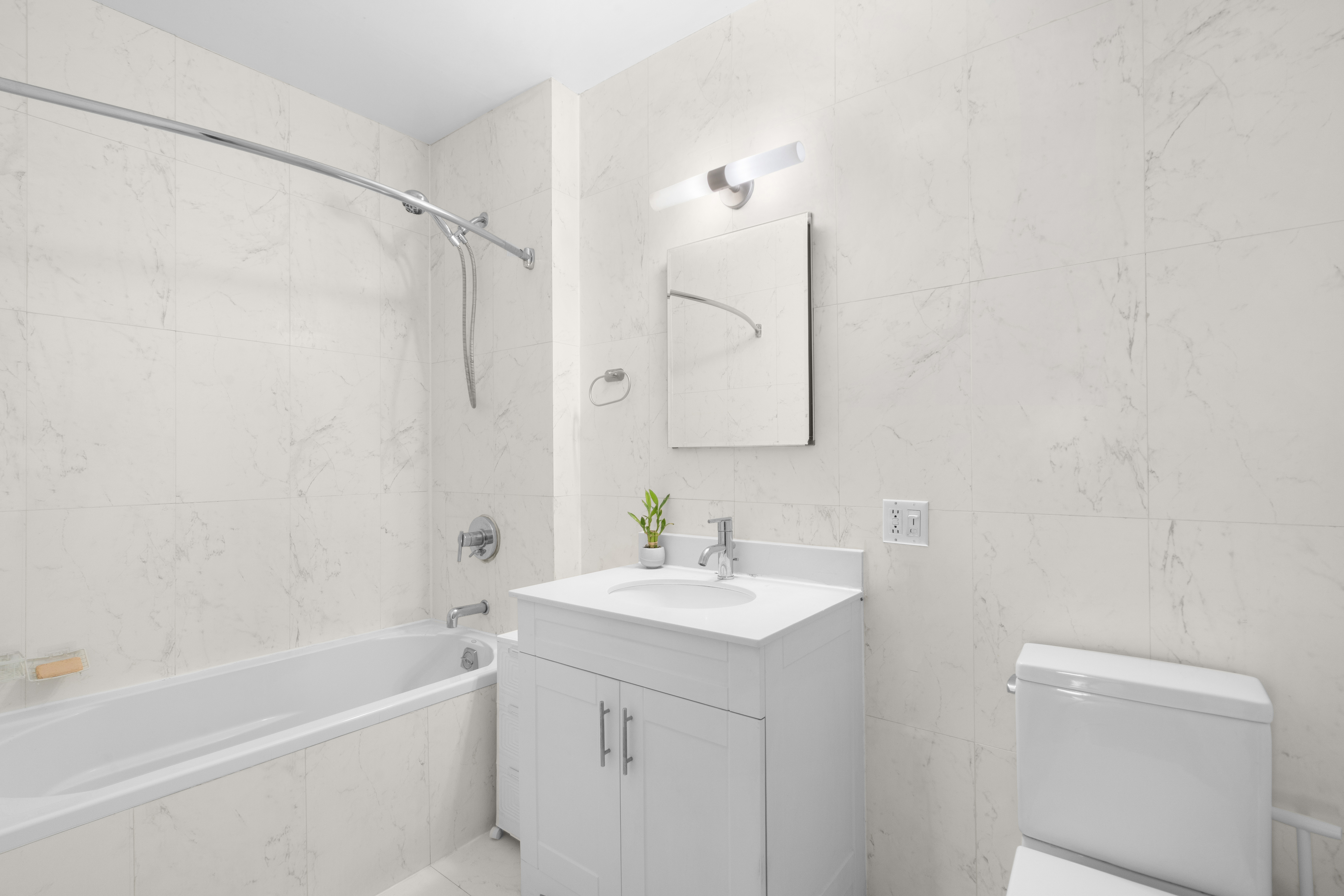 305 West 150th Street, Unit 304 Manhattan, NY 10039 - Photo 5 of 5 a bathroom with a sink a toilet and shower