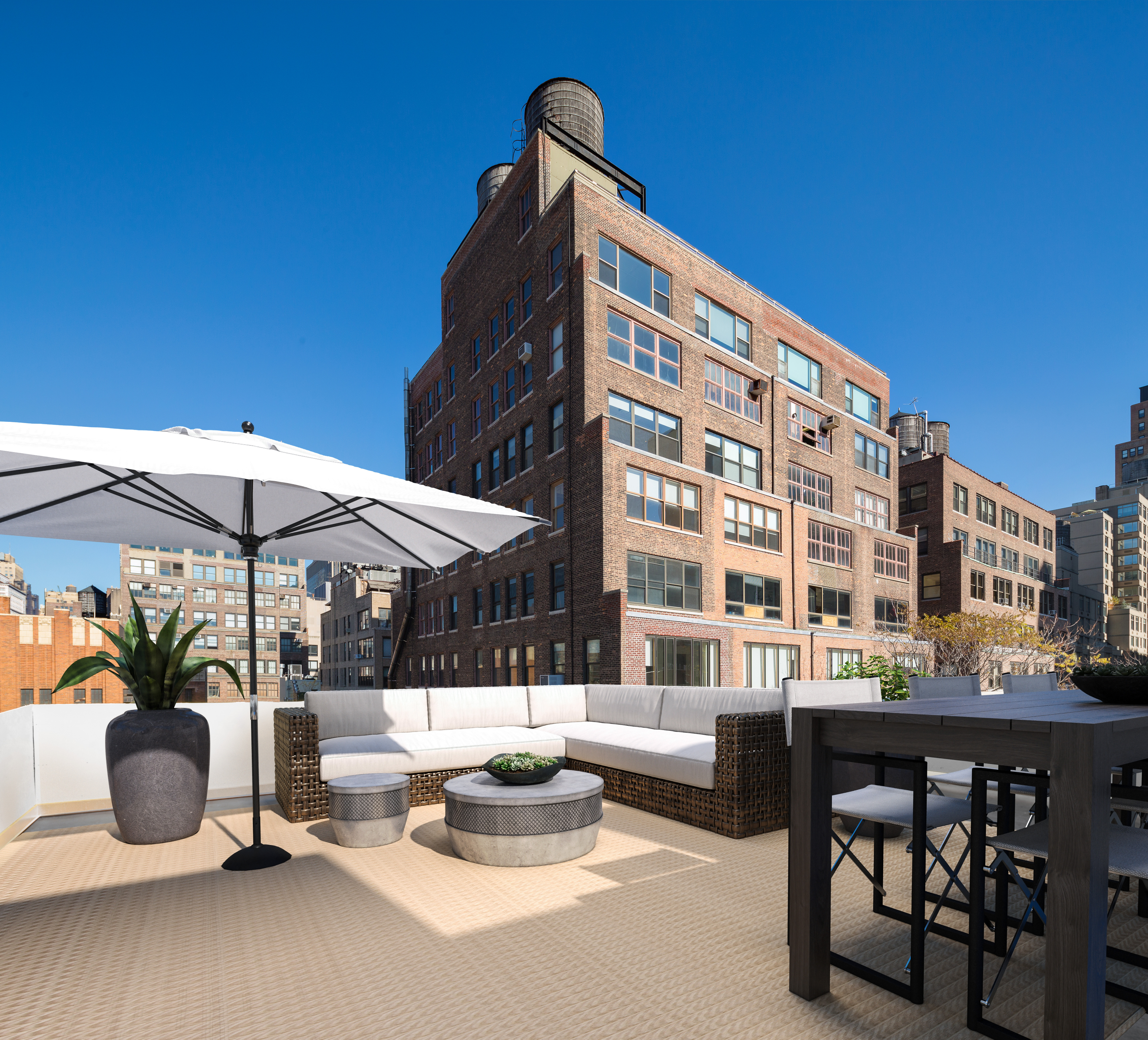 a view of patio with a table and chairs under an umbrella