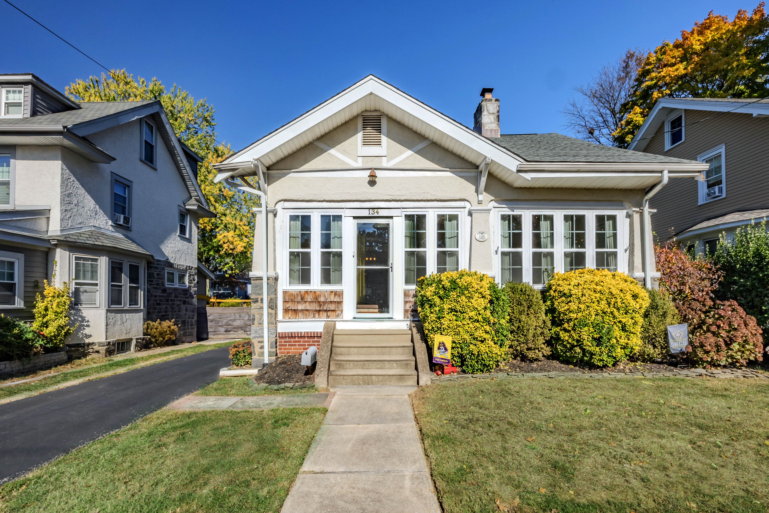a front view of a house with garden