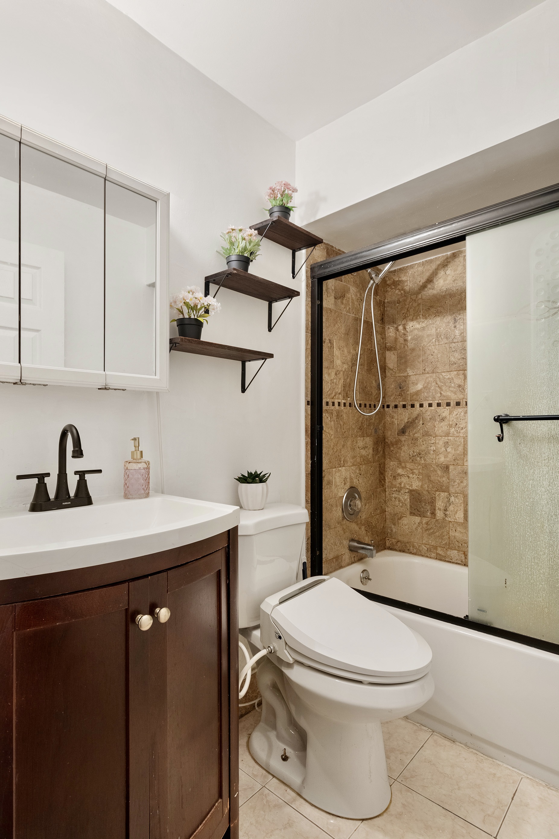 105-09 Otis Avenue, Unit 1B Queens, NY 11368 - Photo 8 of 9 a bathroom with a sink a toilet and shower