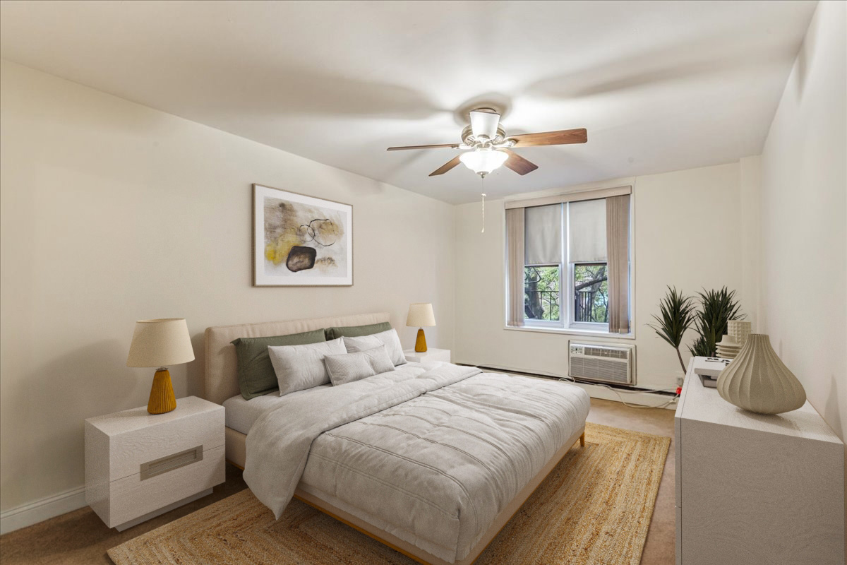 54-44 Little Neck Parkway, Unit 5G Queens, NY 11362 - Photo 10 of 20 a bedroom with a large bed and a chandelier