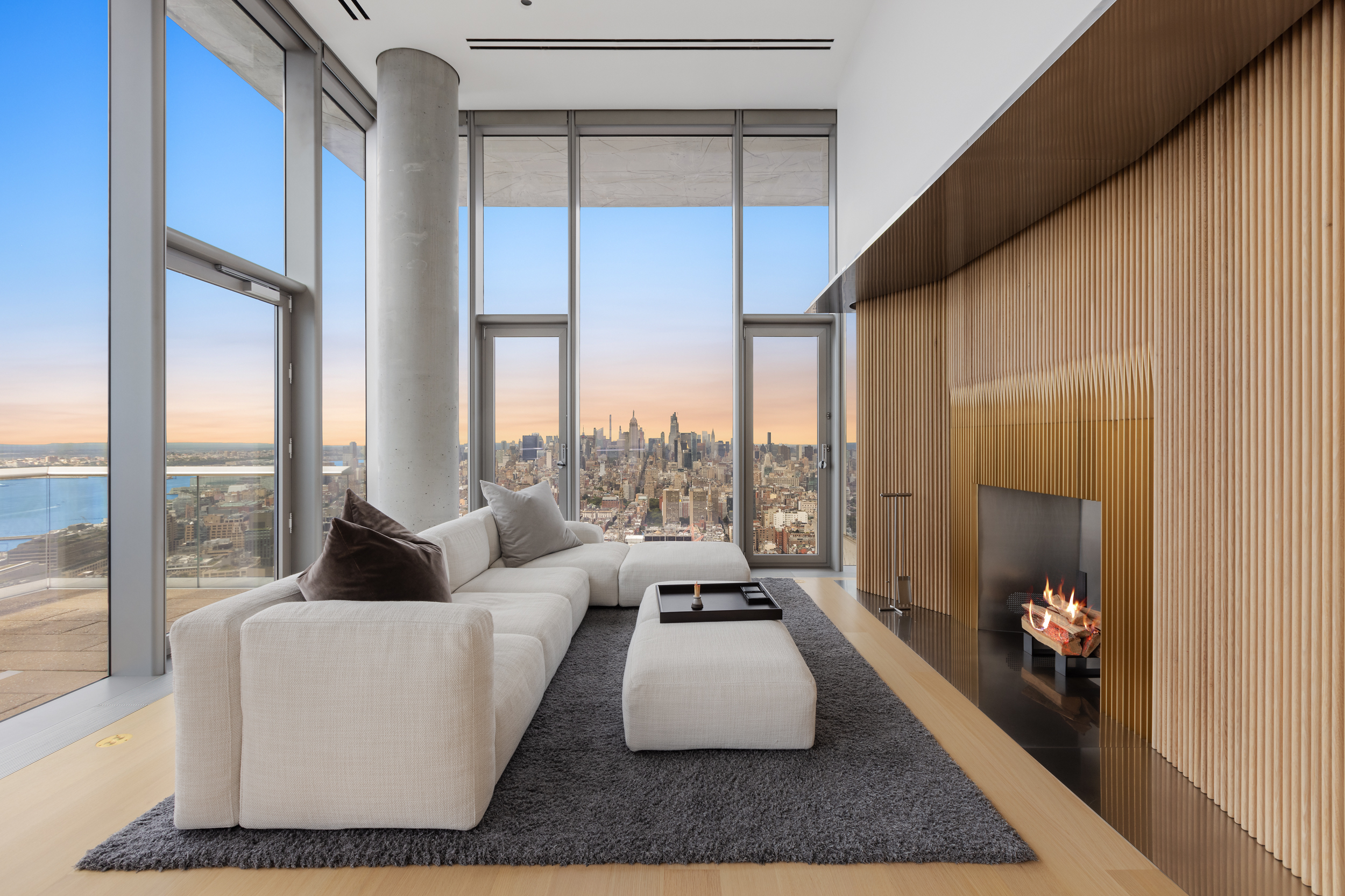 56 Leonard Street, Unit PH52A Manhattan, NY 10013 - Photo 3 of 24 a living room with furniture and a large window