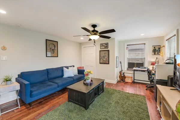 a living room with furniture and a large window