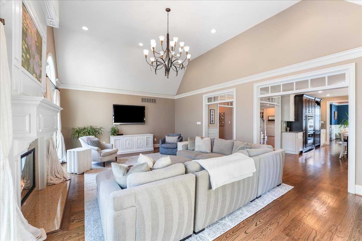 248 Valley Ridge Road Haverford, PA 19041 - Photo 17 of 44 a living room with furniture a chandelier and a flat screen tv