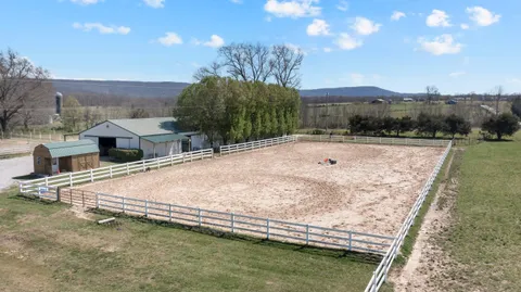 a swimming pool with trees in the background