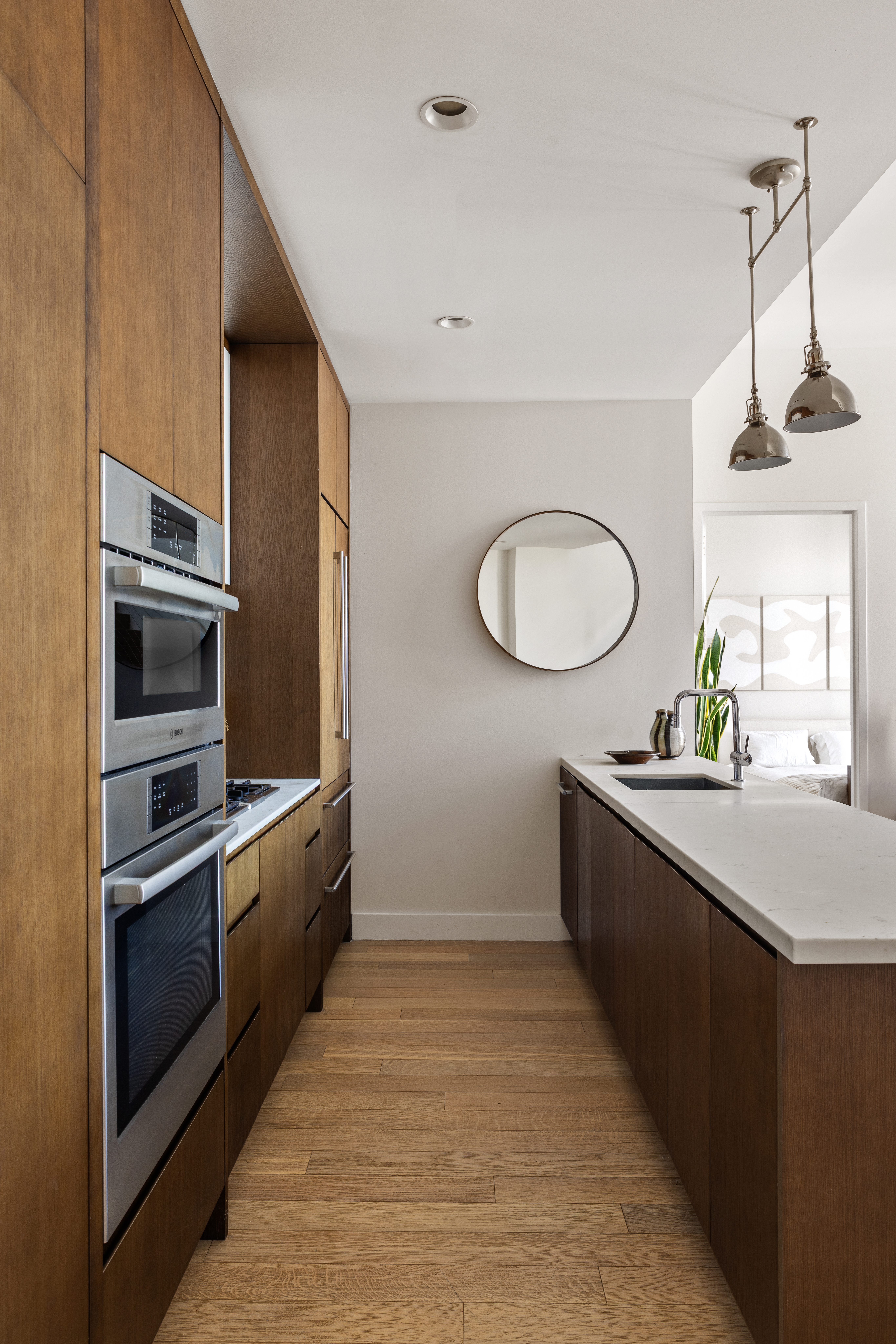 500 Waverly Avenue, Unit PH5 Brooklyn, NY 11238 - Photo 5 of 12 a kitchen with stainless steel appliances a sink and a stove