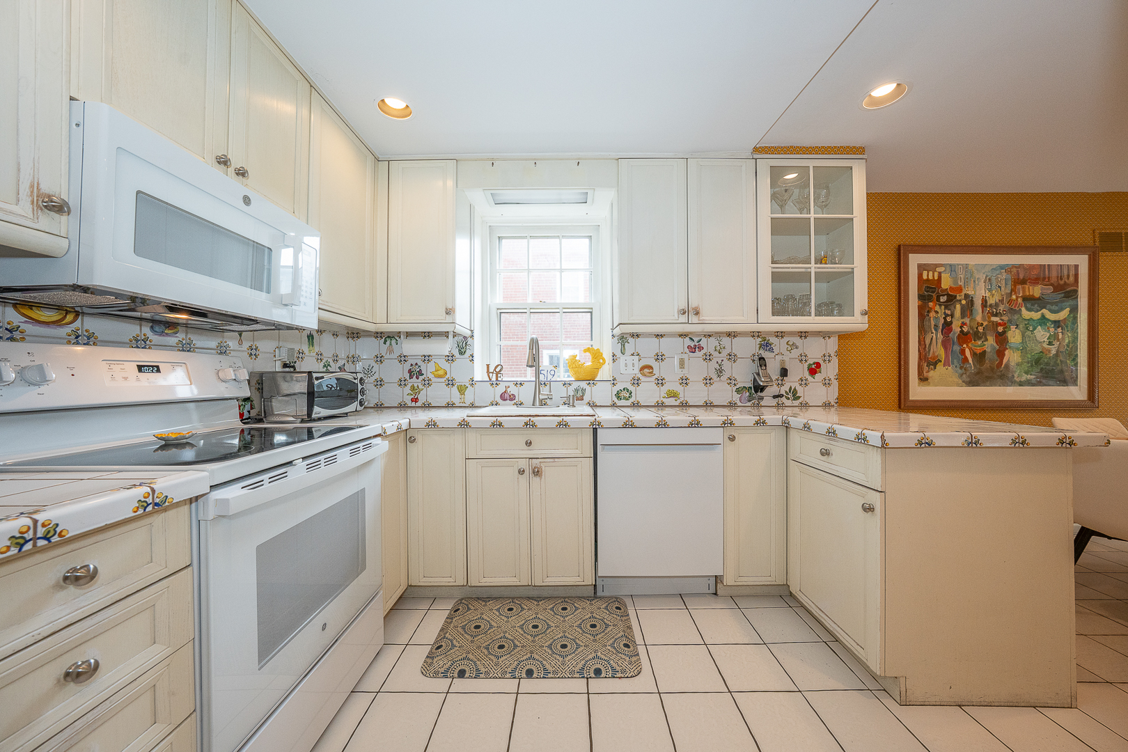 519 Mercer Road Merion Station, PA 19066 - Photo 16 of 58 a kitchen with a white cabinets and white appliances