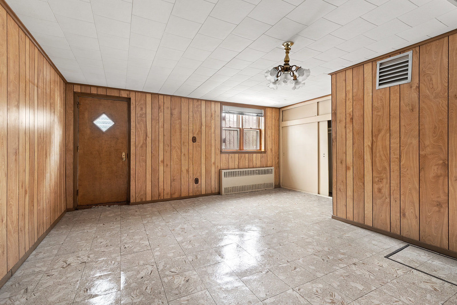 612 17th Street Brooklyn, NY 11218 - Photo 8 of 12 a view of a livingroom with a chandelier
