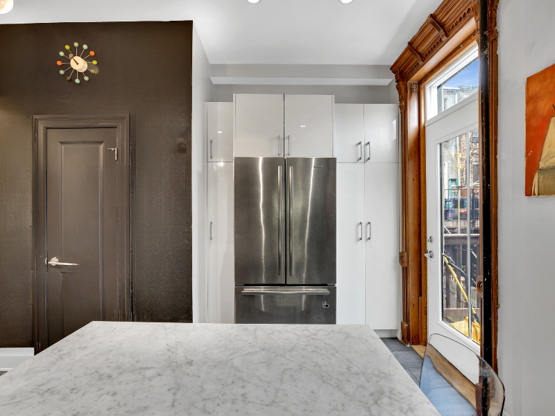 1124 Prospect Place, Unit PLEX Brooklyn, NY 11213 - Photo 9 of 15 a bedroom with windows and closet