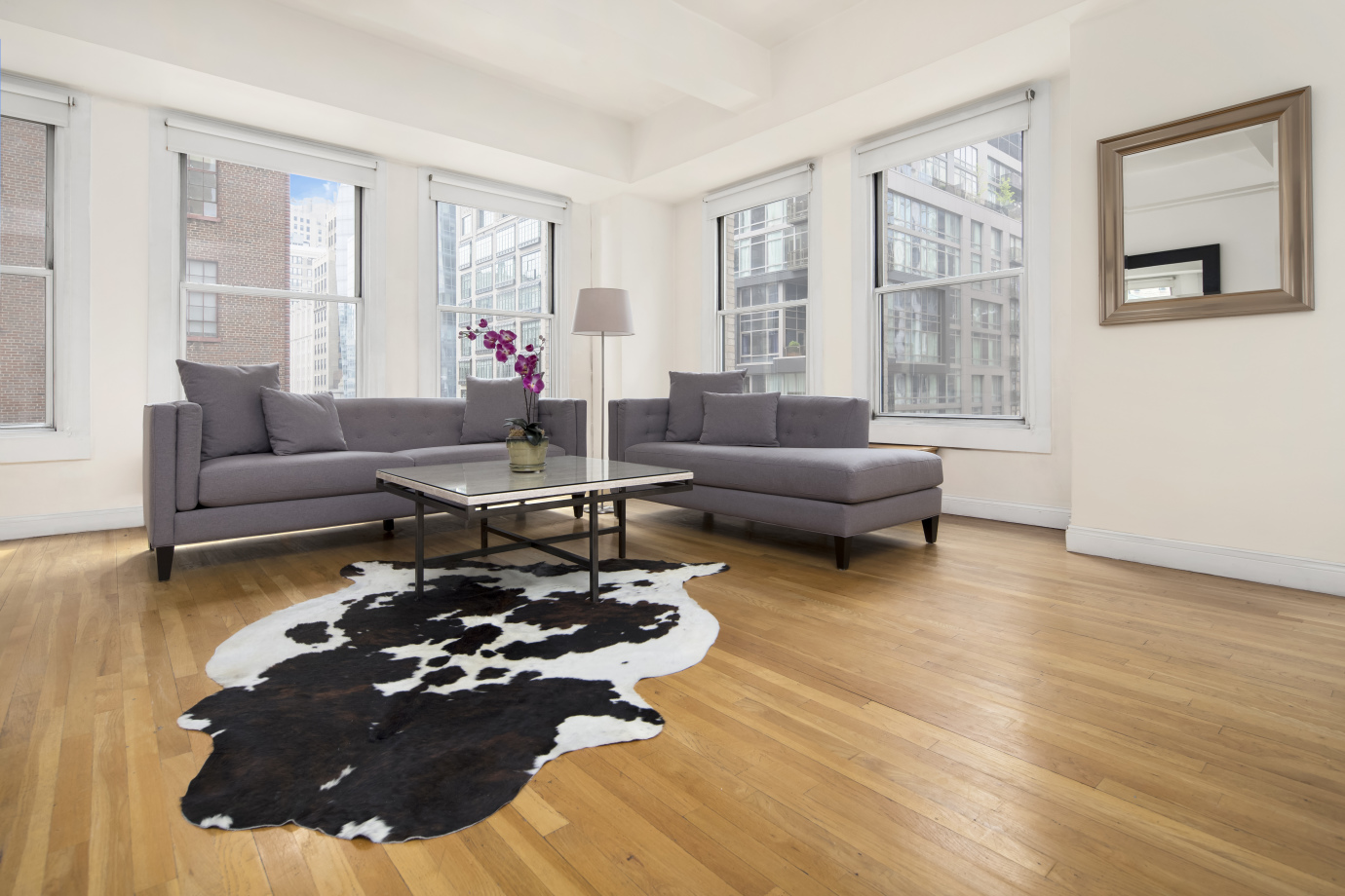 425 Park Avenue South, Unit 9B Manhattan, NY 10016 - Photo 2 of 7 a living room with furniture and a large window