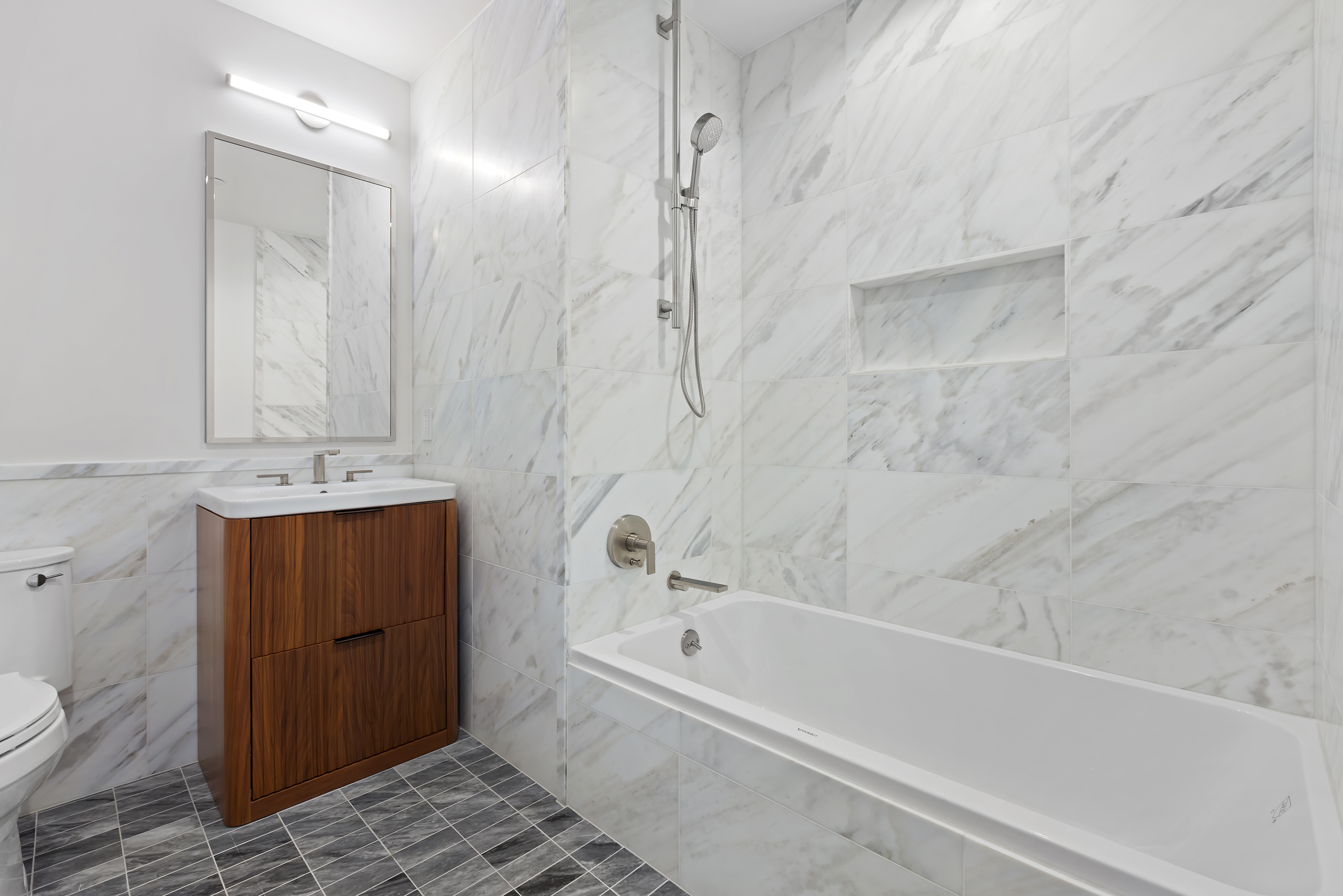 150 Barrow Street, Unit 2B Manhattan, NY 10014 - Photo 7 of 14 a bathroom with a bathtub and a sink