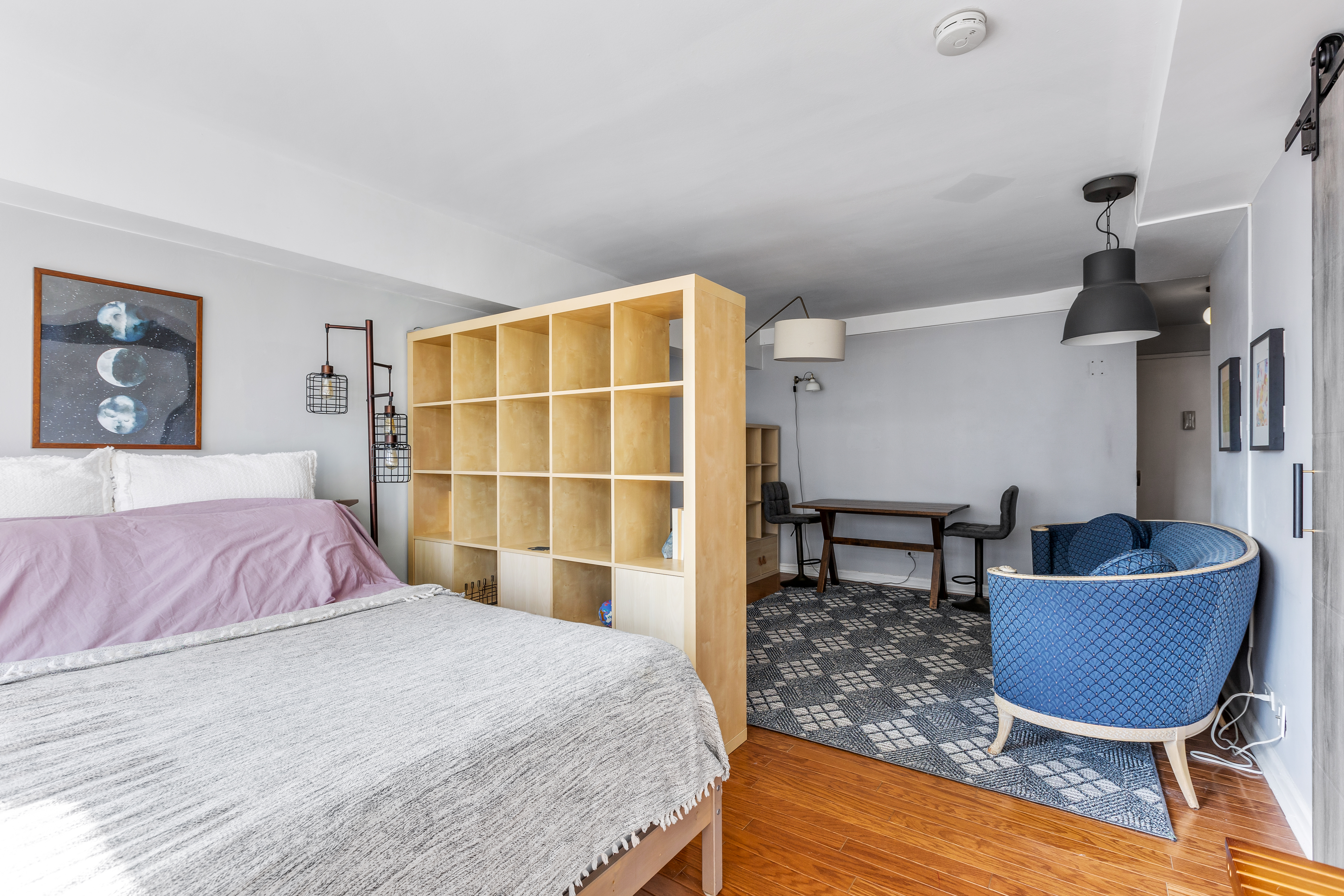 345 East 81st Street, Unit 19A Manhattan, NY 10028 - Photo 7 of 22 a bedroom with a bed a chair and potted plant on the dresser