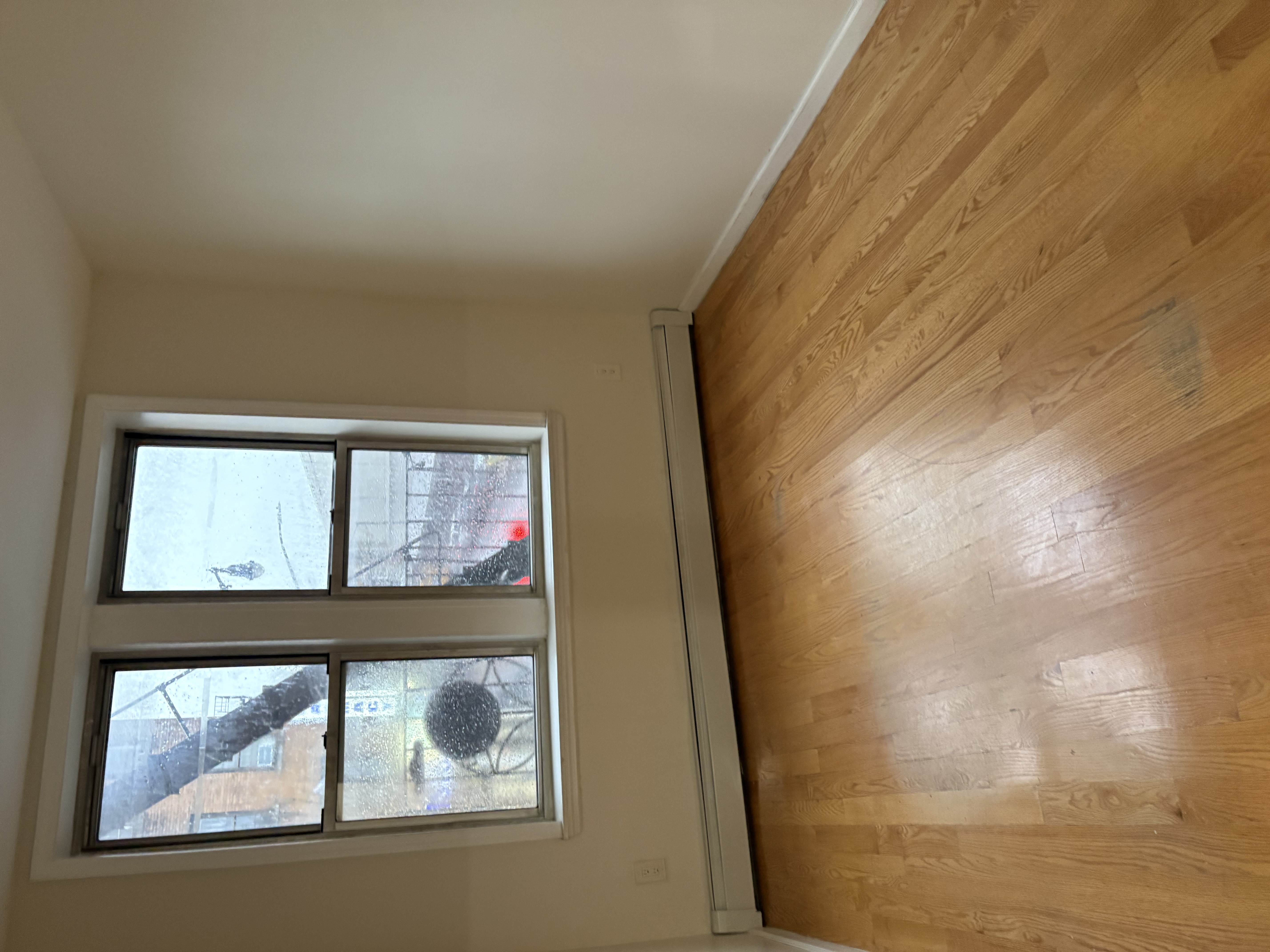 8703 5th Avenue, Unit 2F Brooklyn, NY 11209 - Photo 4 of 9 an empty room with a window