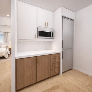 a kitchen with a refrigerator and microwave