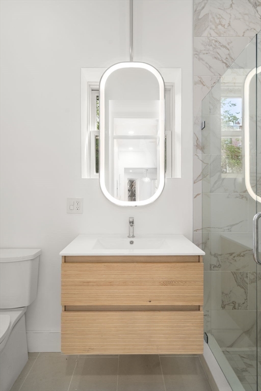 34 Worcester Square, Unit 2 Boston, MA 02118 - Photo 11 of 18 a bathroom with a sink and a mirror