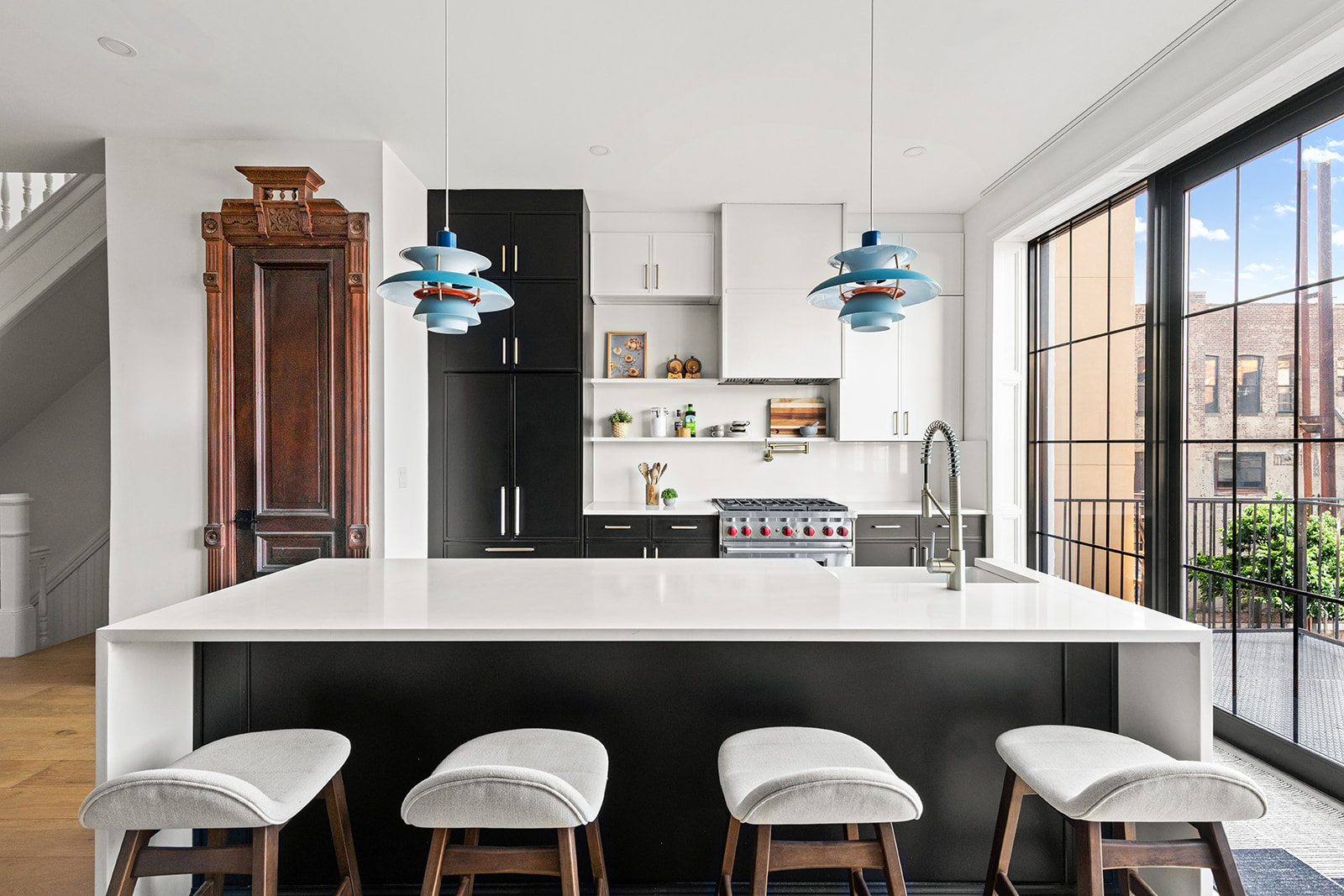 17 Linden Street Brooklyn, NY 11221 - Photo 7 of 19 a kitchen with a table chairs stove and sink
