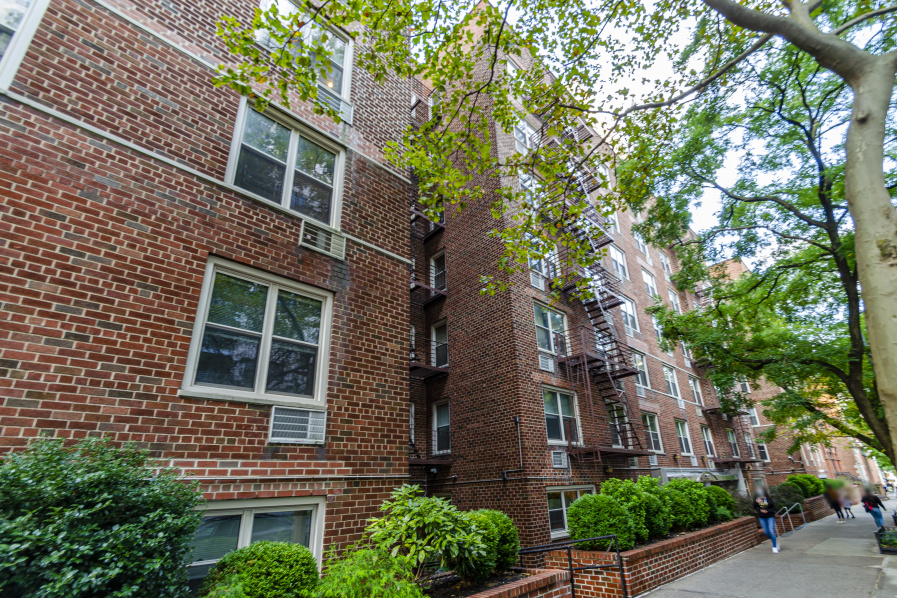 309 East 87th Street, Unit 5A Manhattan, NY 10128 - Photo 8 of 9 a view of a building next to a road