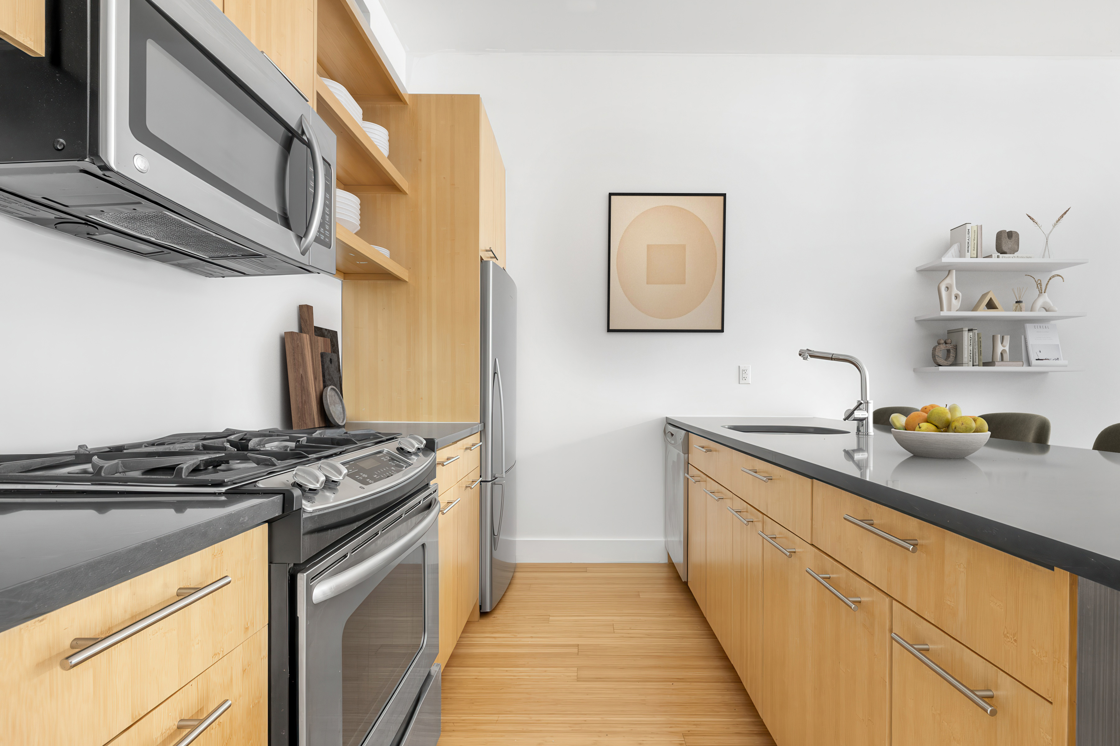 177 Concord Street, Unit 2C Brooklyn, NY 11201 - Photo 4 of 7 a kitchen with stainless steel appliances granite countertop a sink stove and cabinets