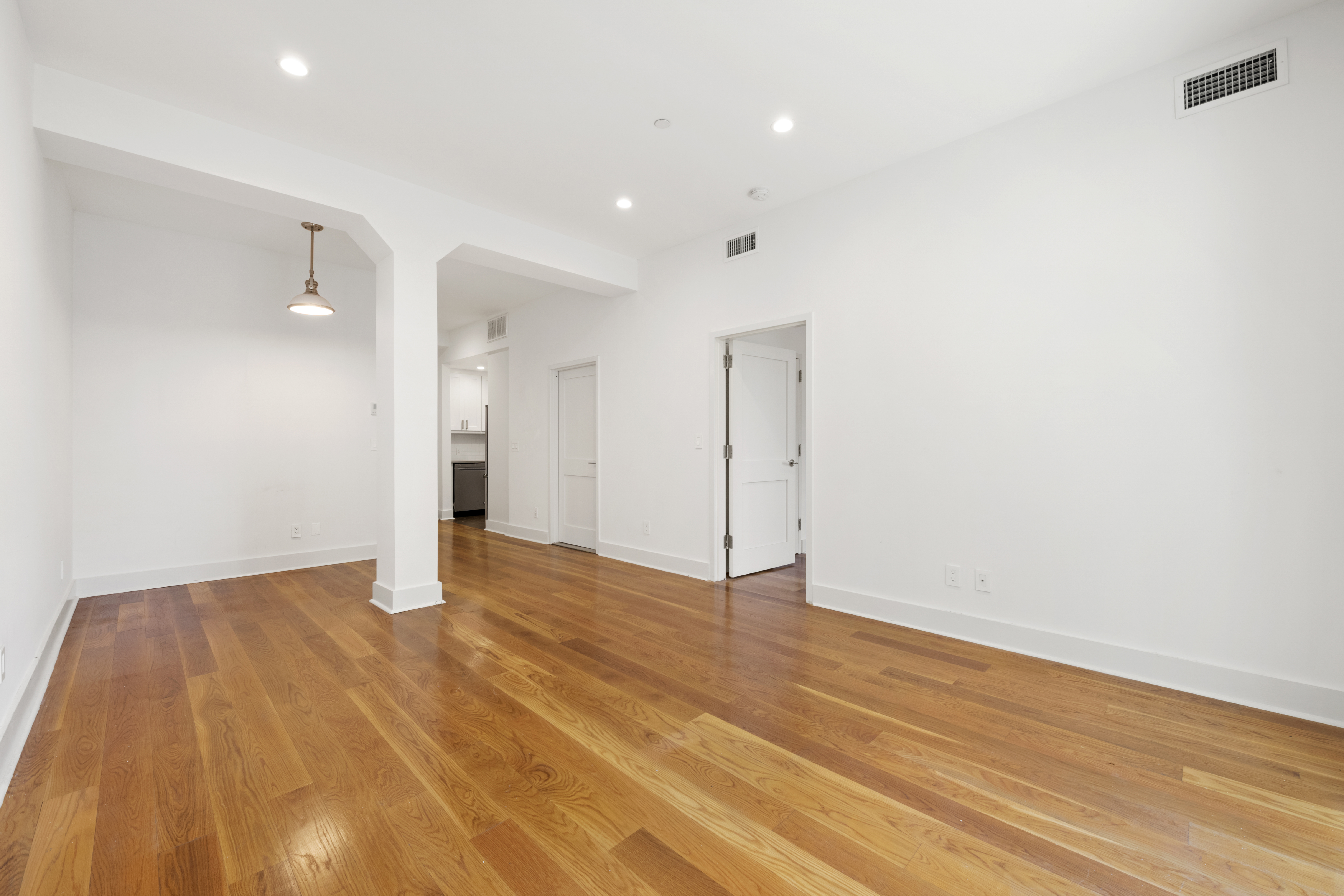 25 Lexington Avenue, Unit 103 Brooklyn, NY 11238 - Photo 4 of 15 a view of an empty room with wooden floor