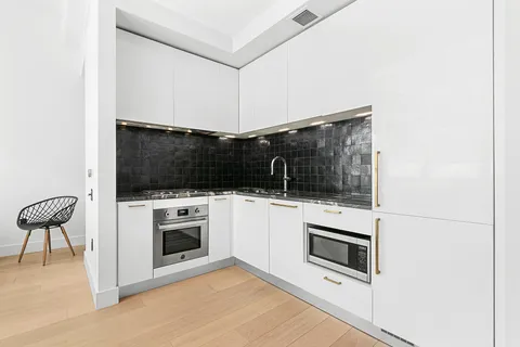 a kitchen with a stove and a microwave