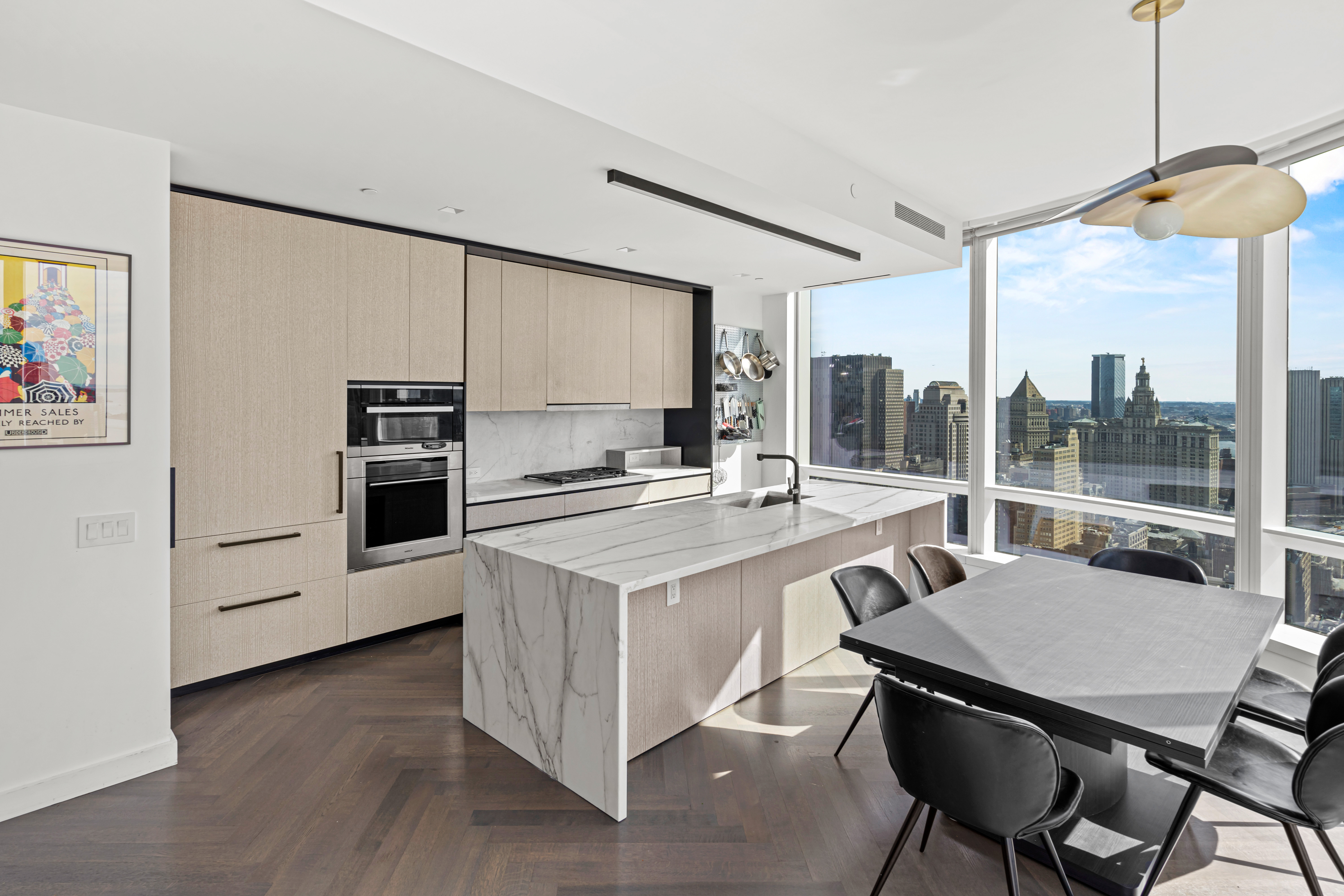 111 Murray Street, Unit 43B Manhattan, NY 10007 - Photo 4 of 17 a kitchen with a stove a refrigerator and a dining table