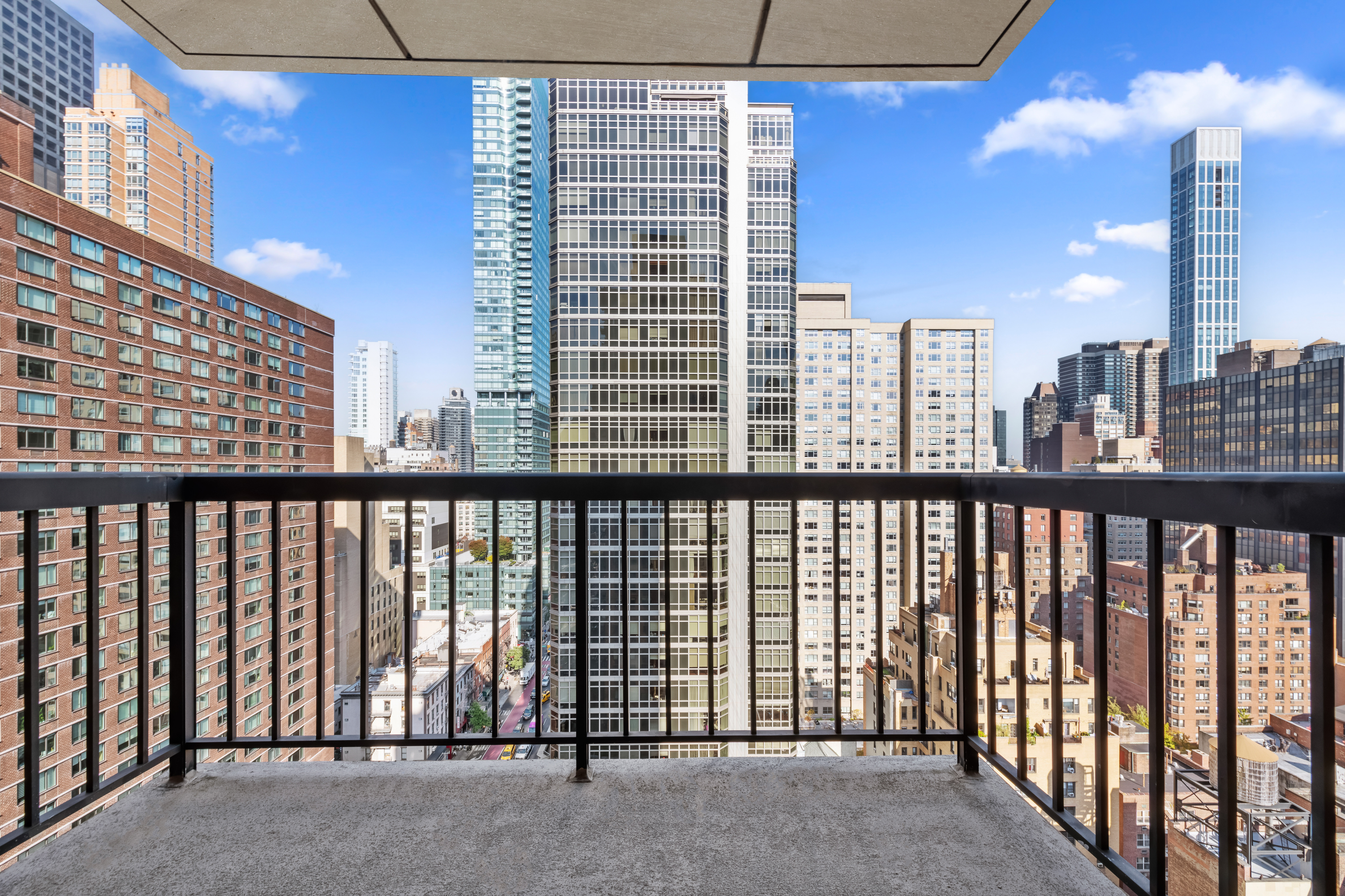 300 East 54th Street, Unit 23J Manhattan, NY 10022 - Photo 8 of 18 a view of balcony with furniture