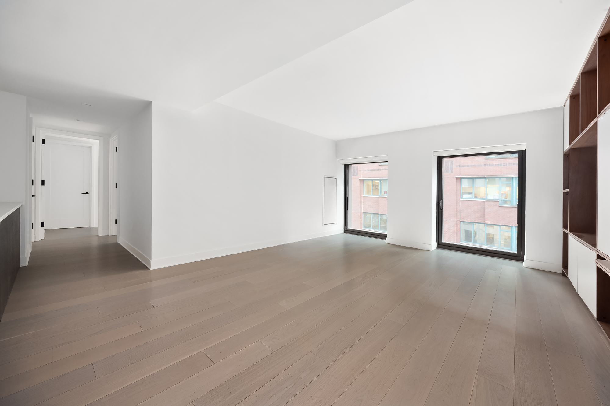 55 West 17th Street, Unit 603 Manhattan, NY 10011 - Photo 2 of 9 a view of an empty room with a window and closet area