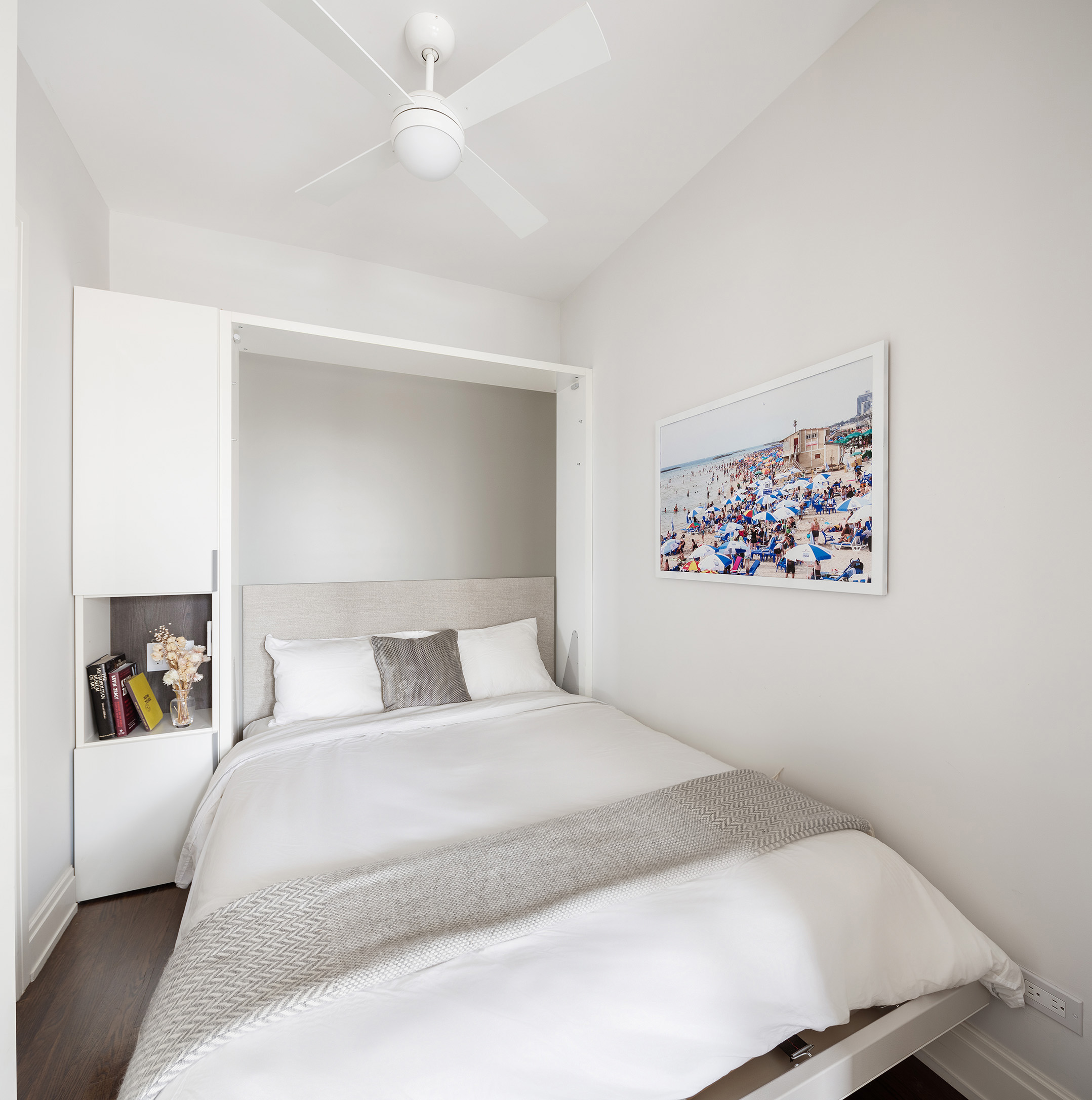 49 East 86th Street, Unit 17B Manhattan, NY 10028 - Photo 6 of 11 a bedroom with a bed and a book shelf