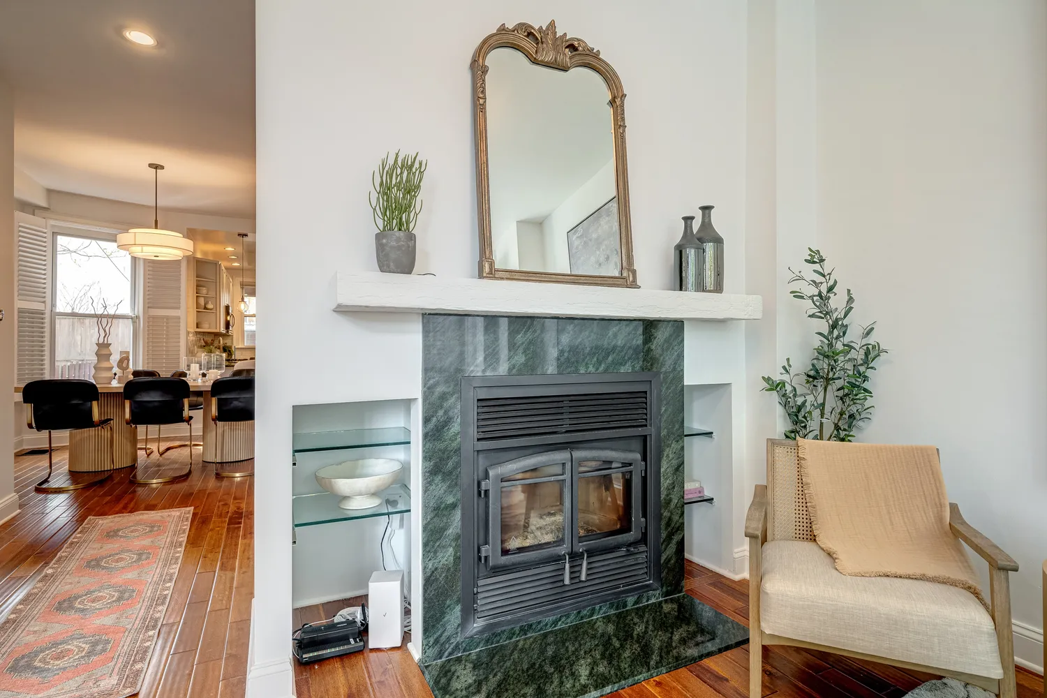 a kitchen with kitchen island a counter top space a sink stainless steel appliances and cabinets