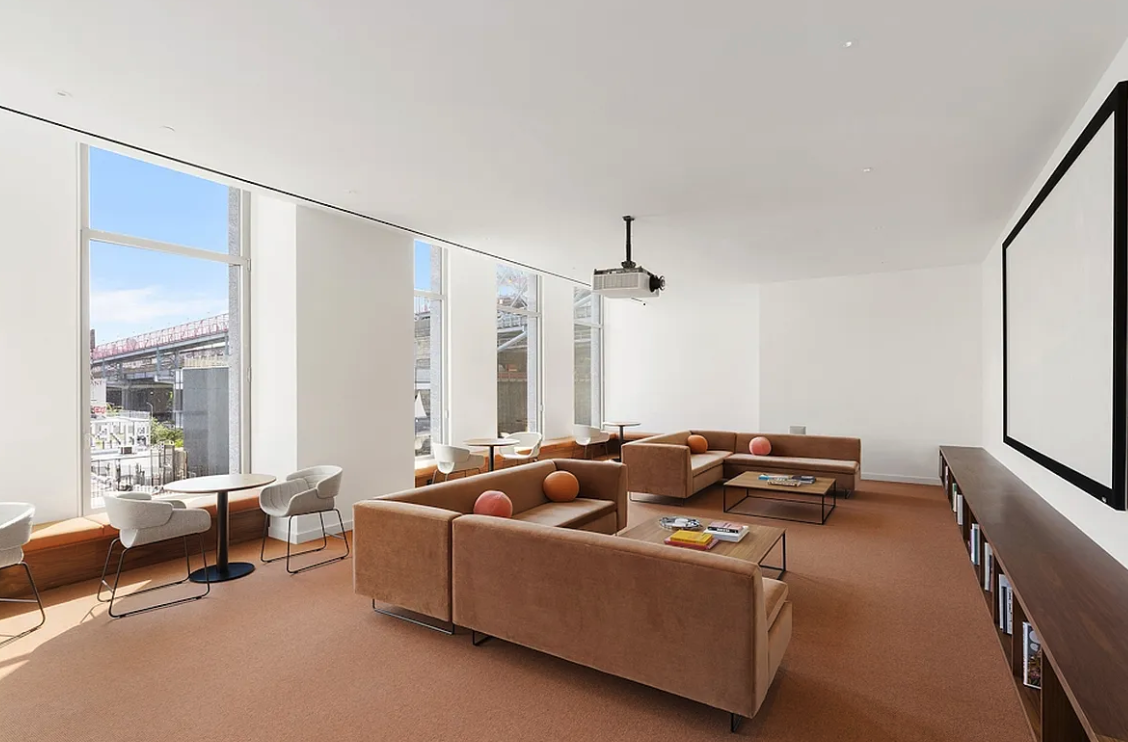 5 South 5th Street, Unit 913 Brooklyn, NY 11249 - Photo 17 of 24 a living room with furniture and a large window