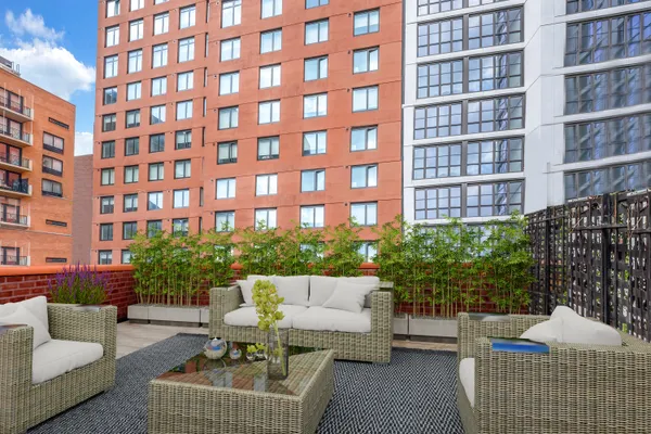 a view of a building and outdoor seating